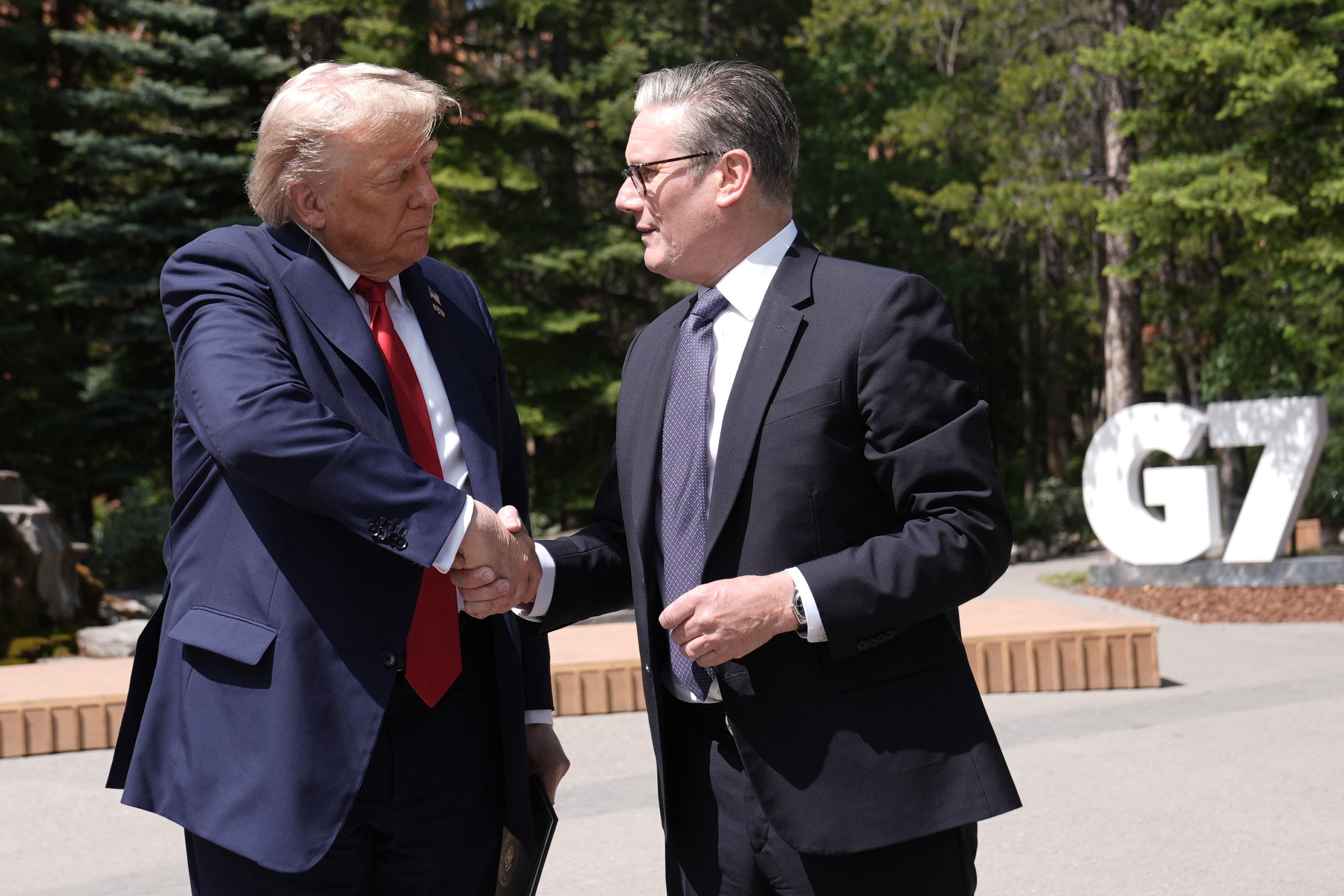 US President Donald Trump, left, will meet Prime Minister Sir Keir Starmer, right in Scotland later this month (Stefan Rousseau/PA)