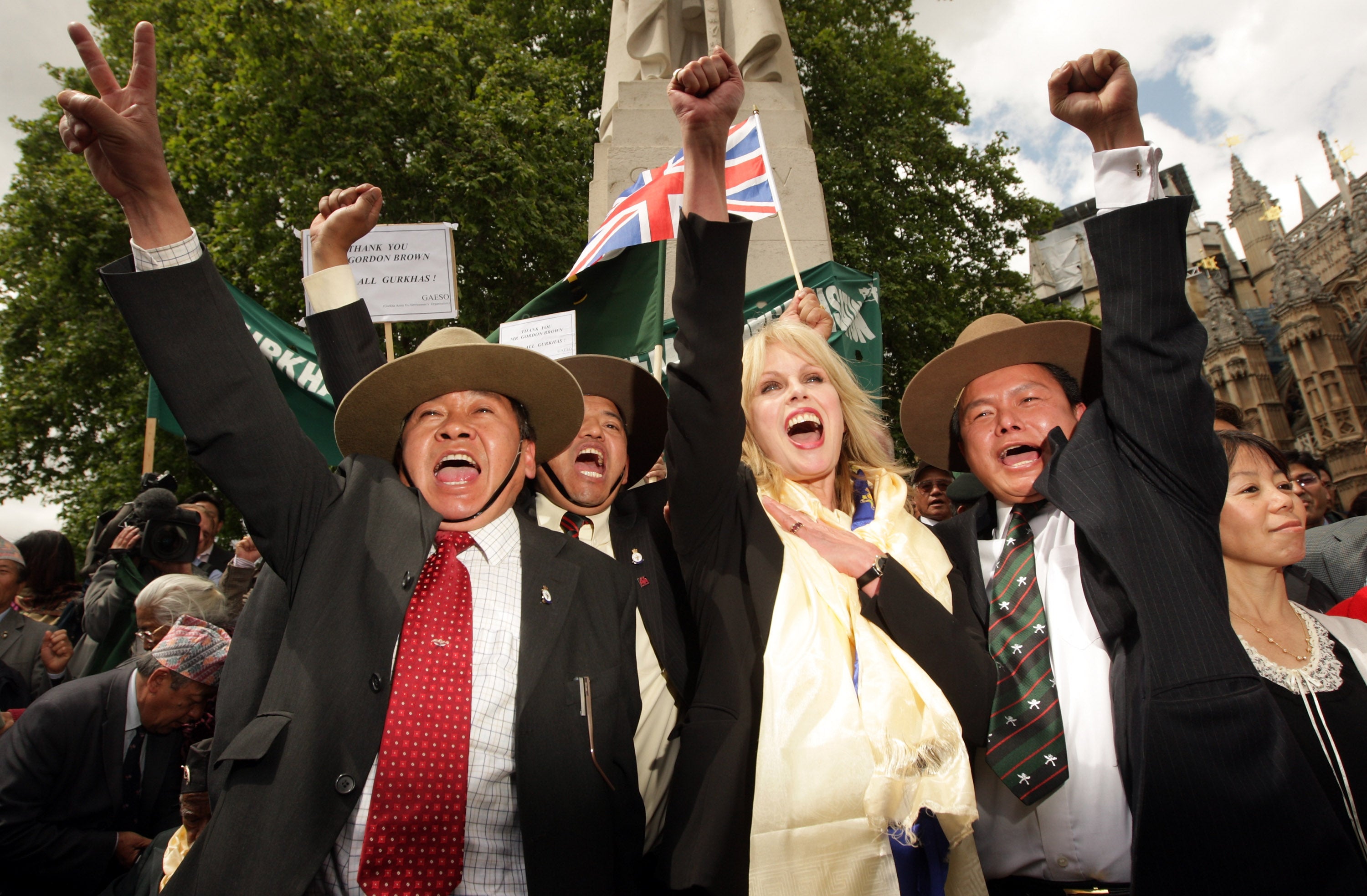Joanna Lumley celebrates with retired Gurkha soldiers outside parliament in 2009