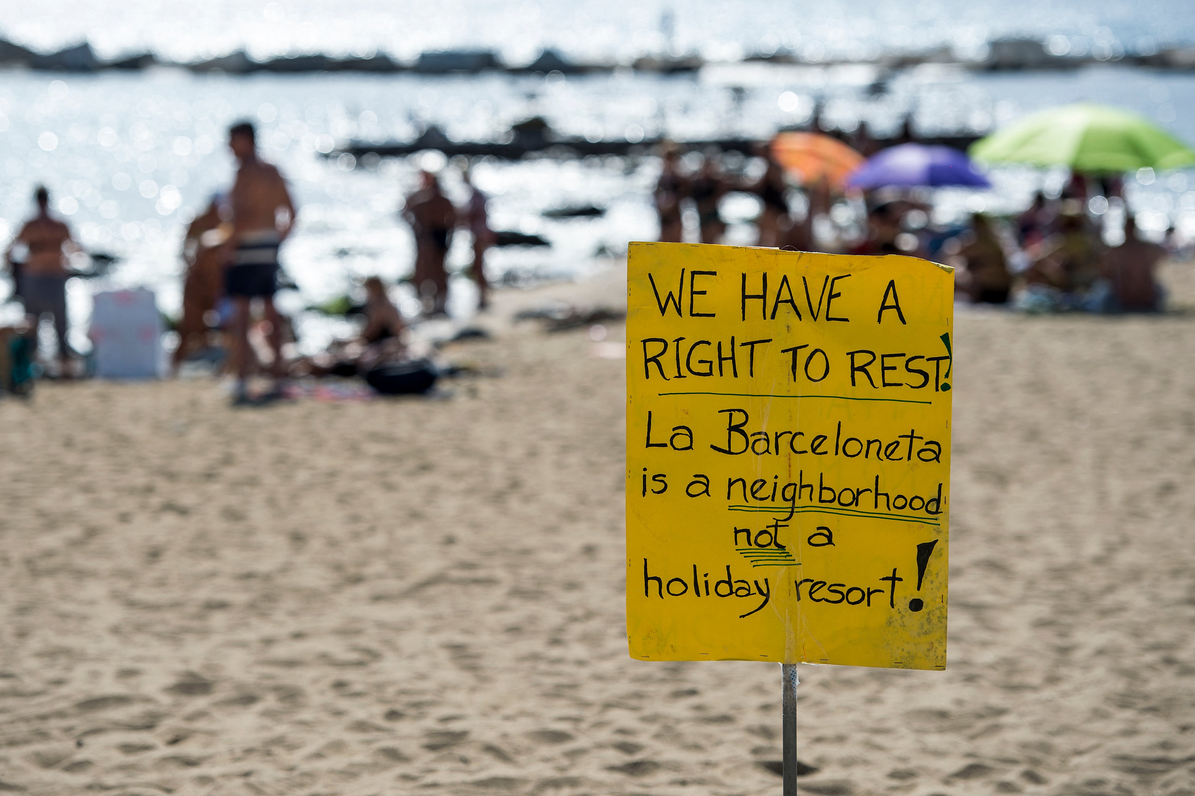 Picture shows a protest-placard on La Barceloneta beach during a demonstration against ‘drunken tourism’ called by the residents of La Barceloneta neighbourhood in Barcelona, on August 12, 2017