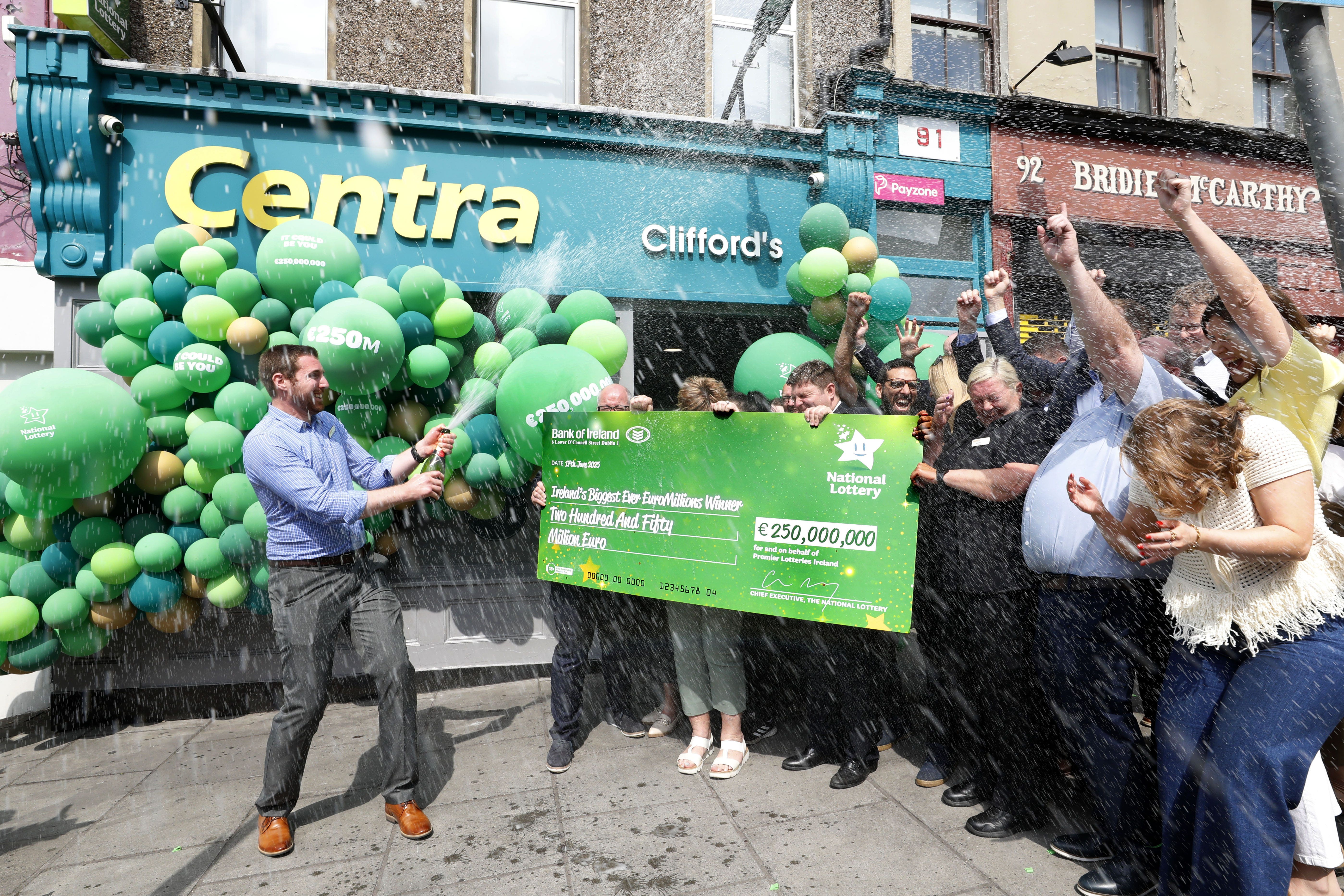 Store manager Simon Champ celebrating with staff from Clifford’s Centra in Cork