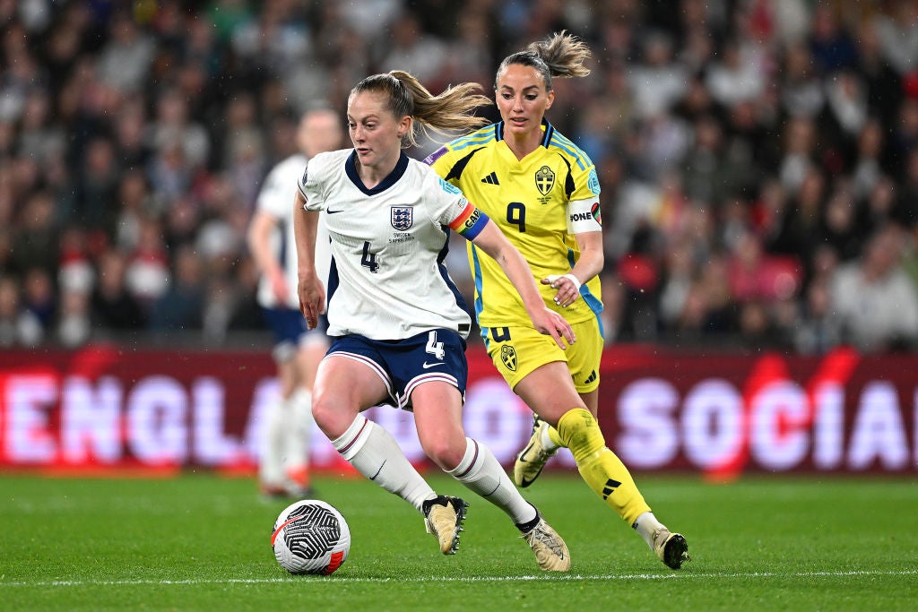Kosovare Asllani chases England's Keira Walsh during the Euro qualifiers