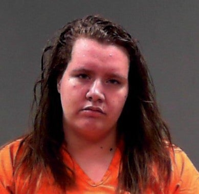 Maggie Denham was arrested after allegedly wielding weapons and threatening the pregnant victim