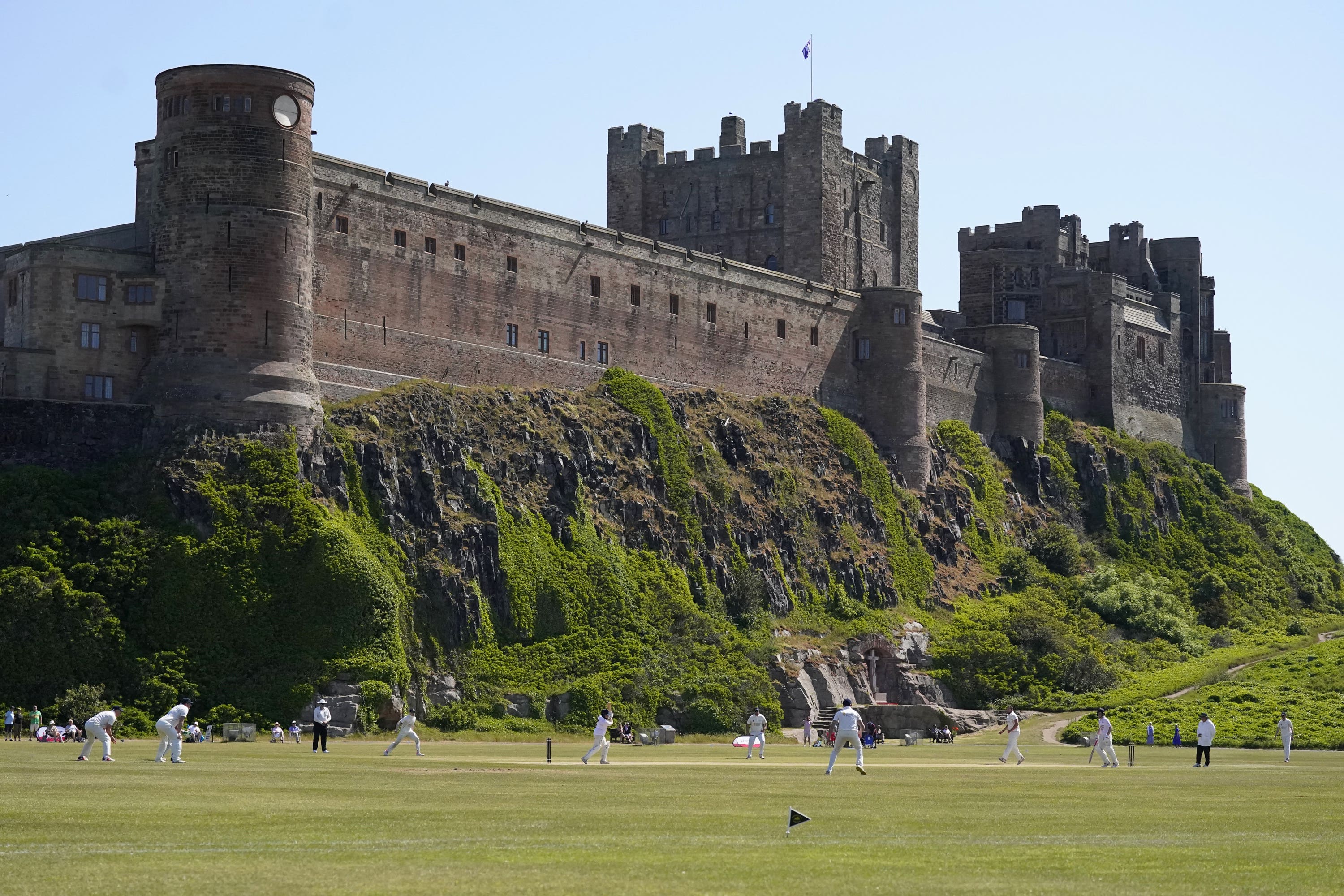 Bamburgh Castle features on the interactive map of coastal landmarks by Historic England (Owen Humphreys/PA)