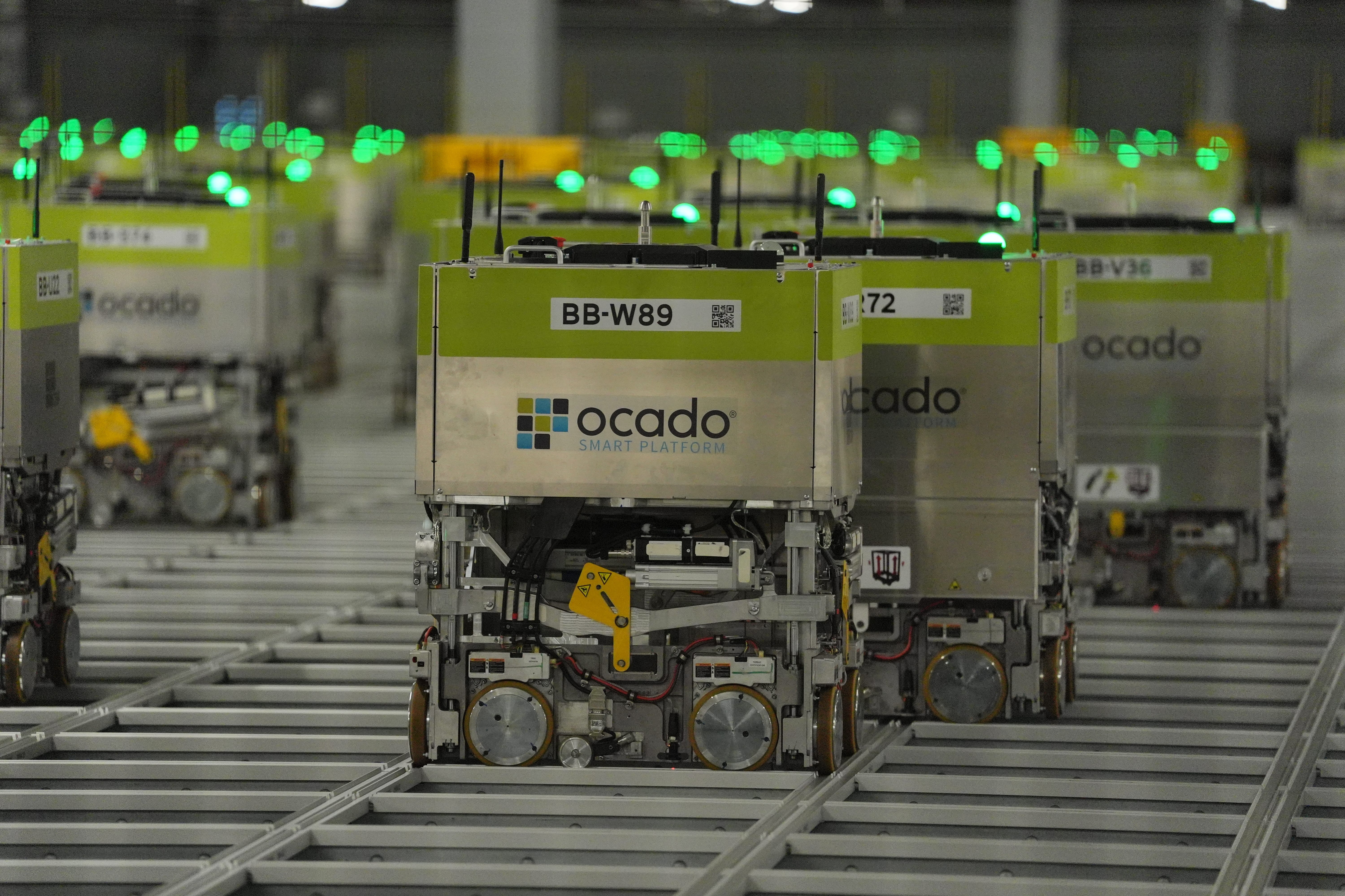 Automated picking machines at the Ocado distribution warehouse in Luton. The company saw shares jump after reporting a return to profit and stronger sales (Jonathan Brady/PA)