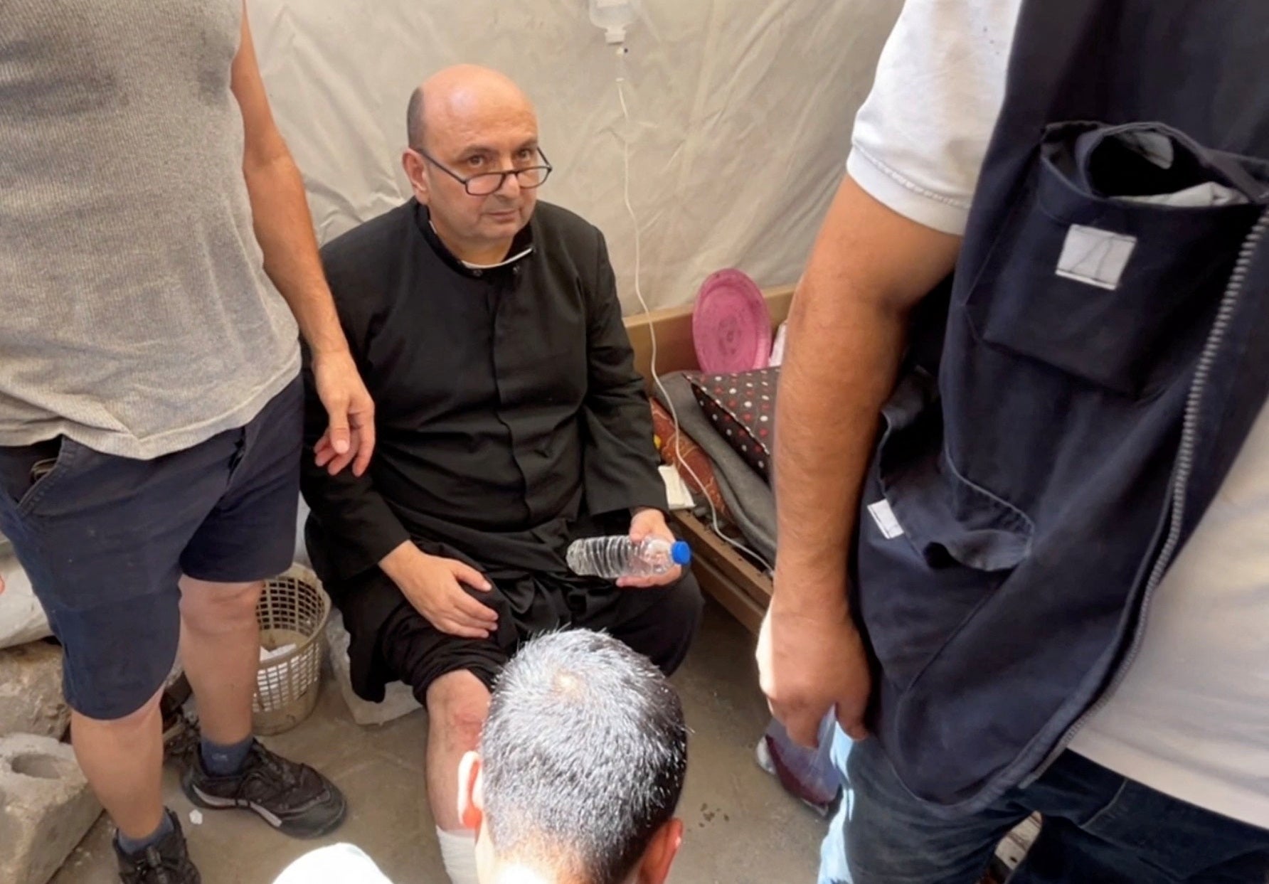 Father Gabriele Romanelli suffered light leg injuries