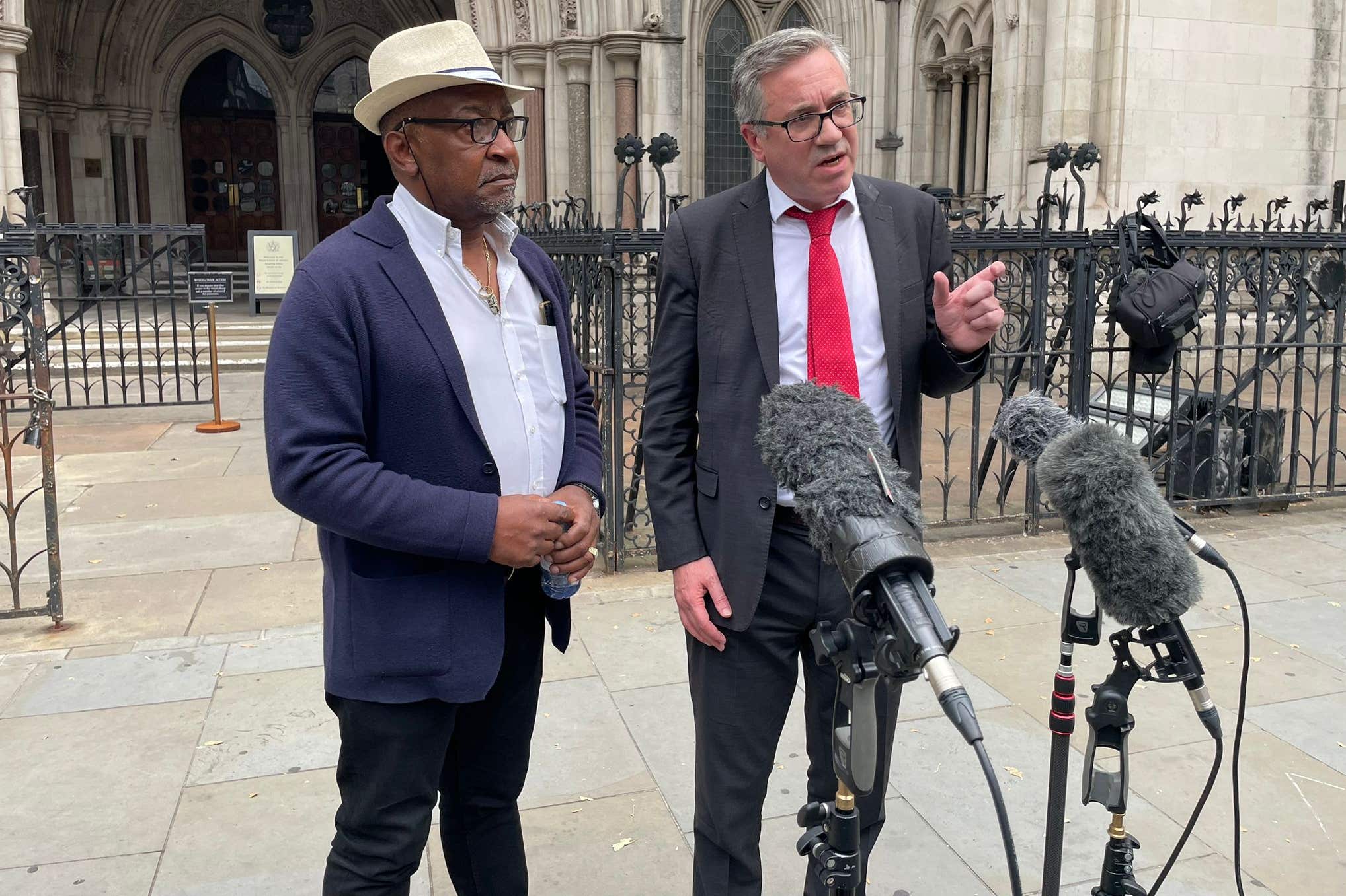 Errol Campbell Jr (left) and solicitor Matt Foot speaking outside the Royal Courts of Justice after Mr Campbell Jr’s father, Errol Campbell, was posthumously cleared at the Court of Appeal (Callum Parke/PA)