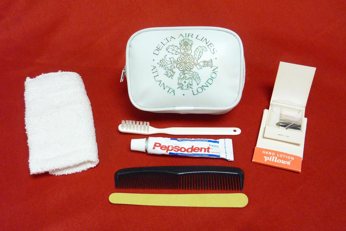 This 1978 kit featured a white bag, Pepsodent toothpaste, a comb, hand lotion, a hand towel, and a large nail file