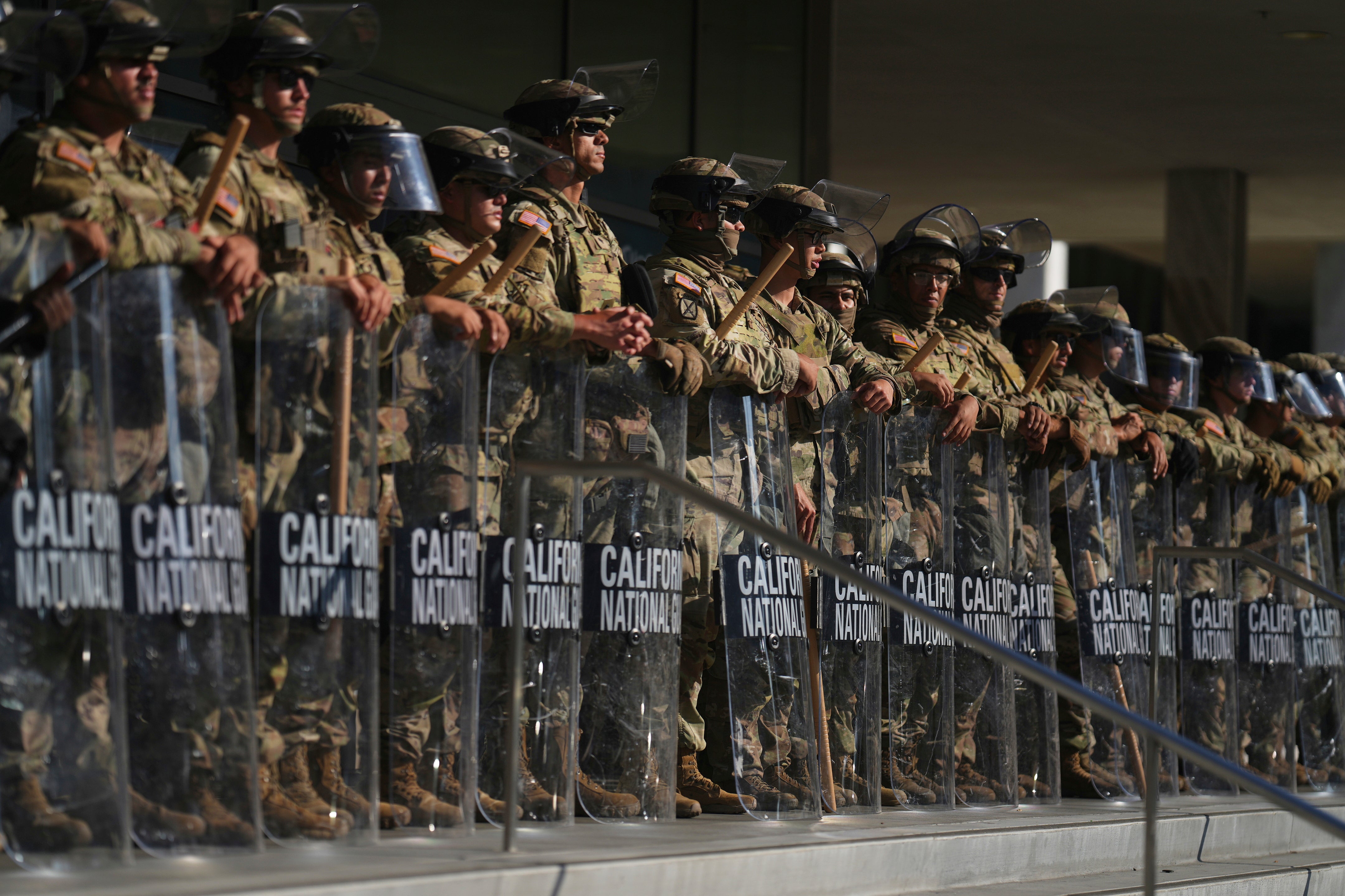 California National Guard troops stand guard as protests swelled in Los Angeles last month. Trump deployed more than 4,000 troops to the area
