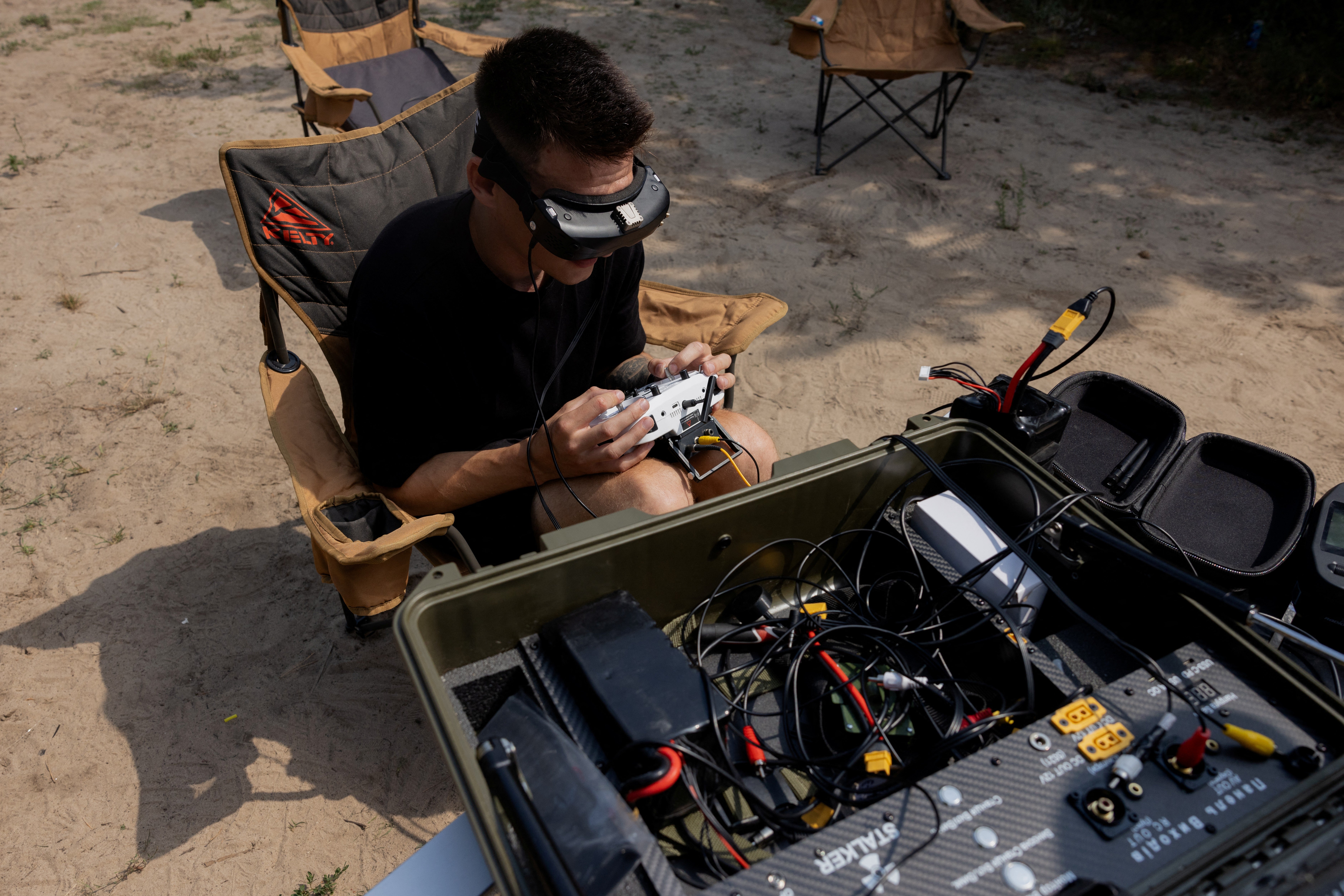 A drone pilot controls a Ukranian fiber-optic FPV Drone Stalker
