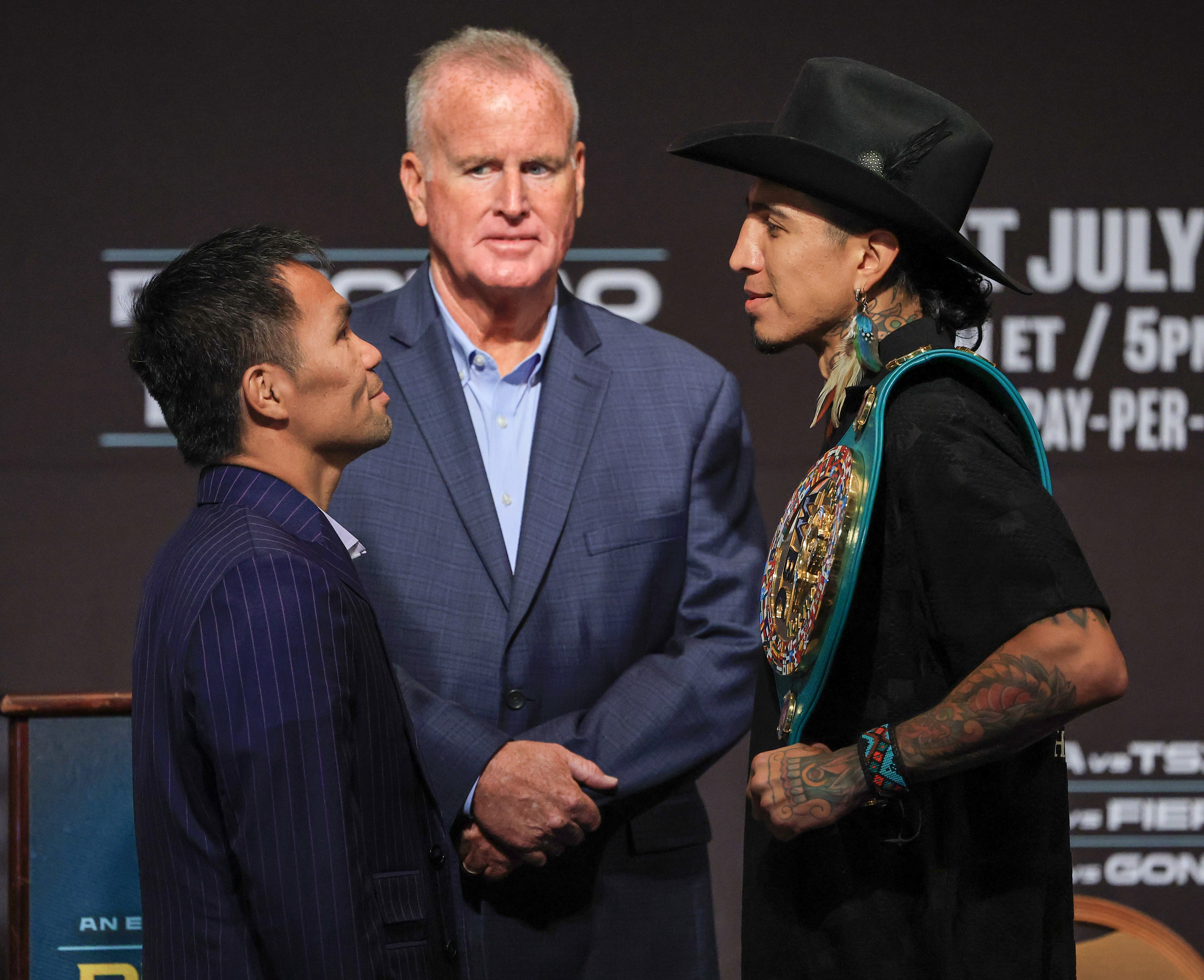 Manny Pacquiao (left) and Mario Barrios face off
