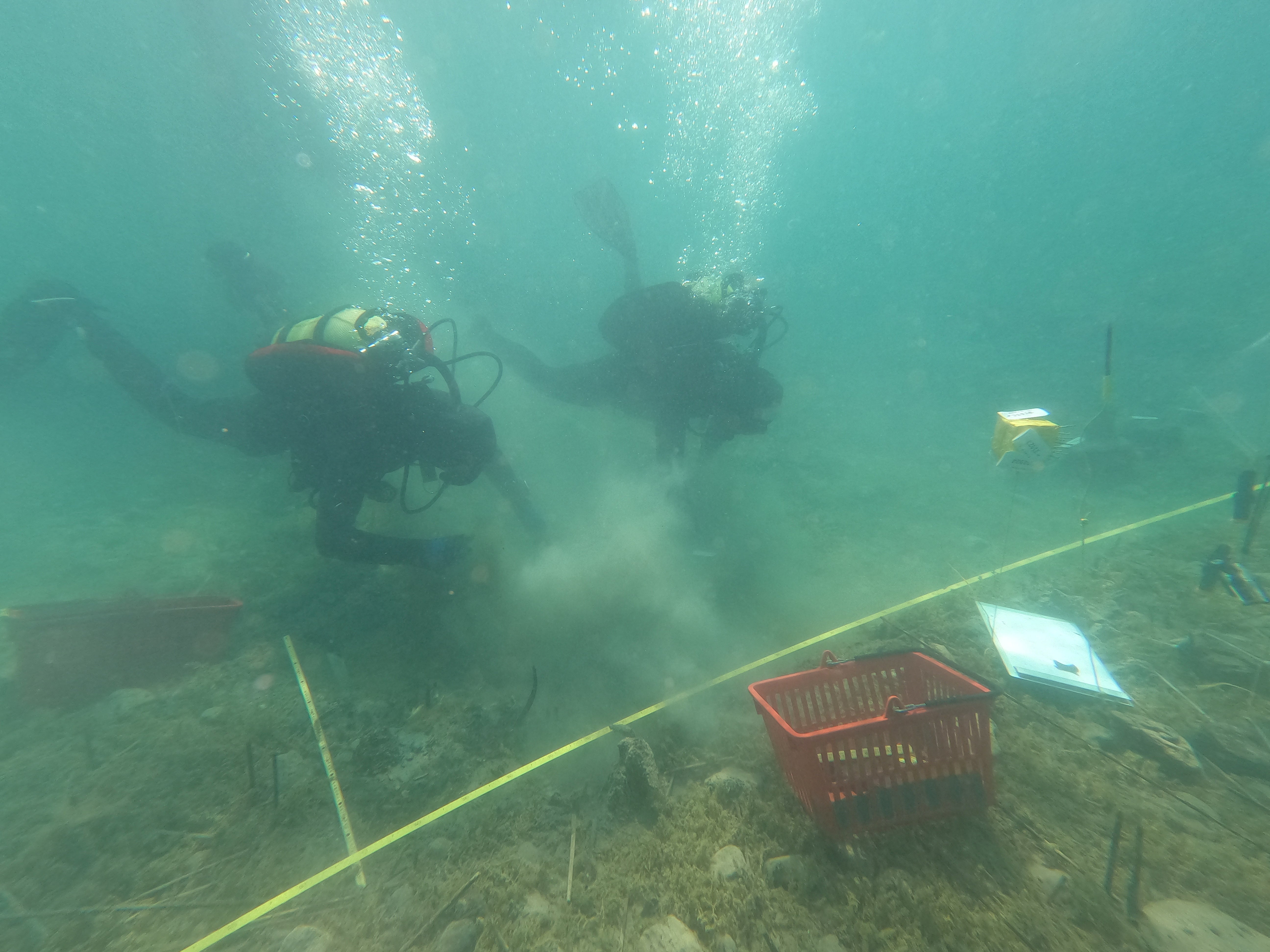 The team, from Switzerland and Albania, spends hours each day underwater