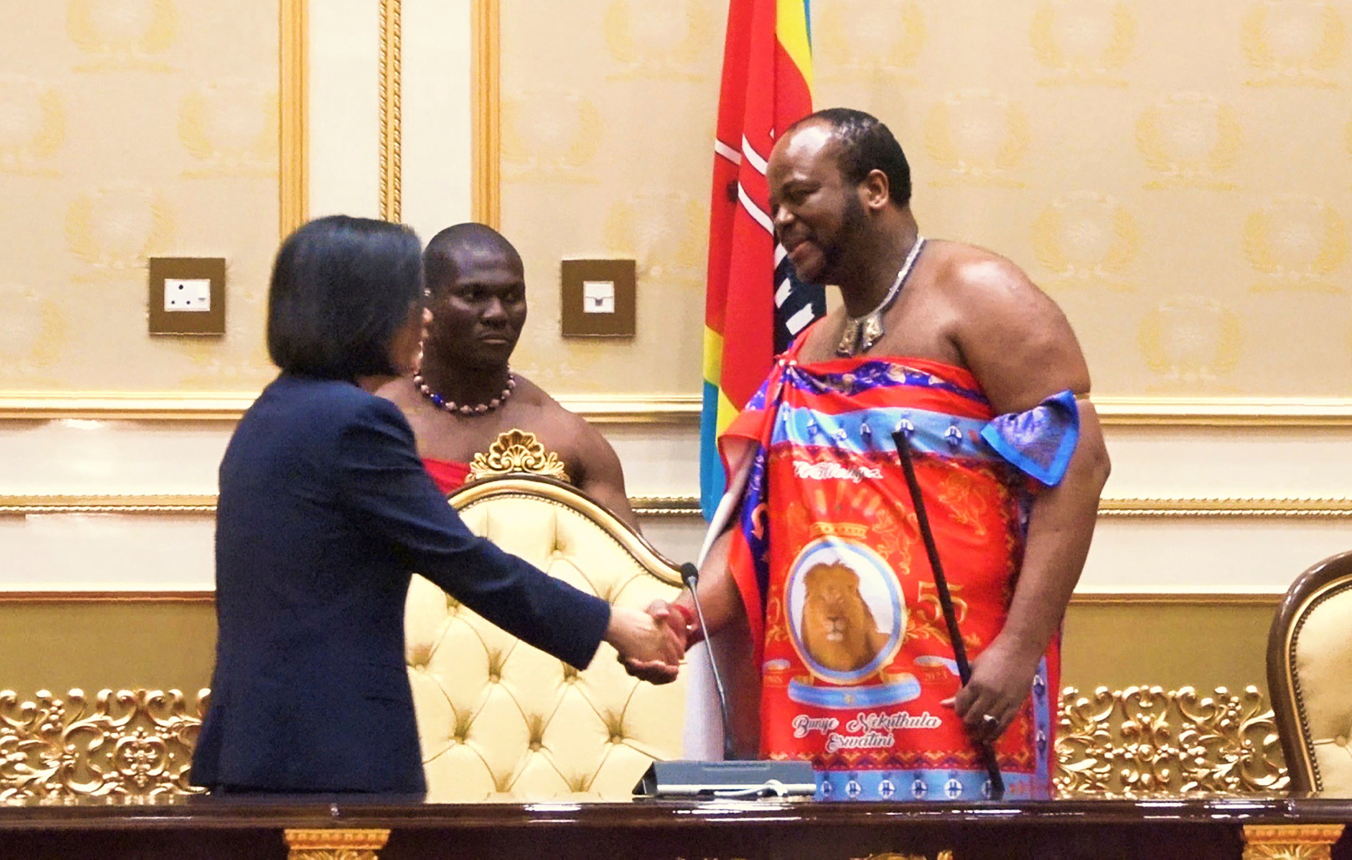 Taiwan's President Tsai Ing-wen, left, shakes hands with Eswatini's King Mswati III at the royal palace in Ludzidzini