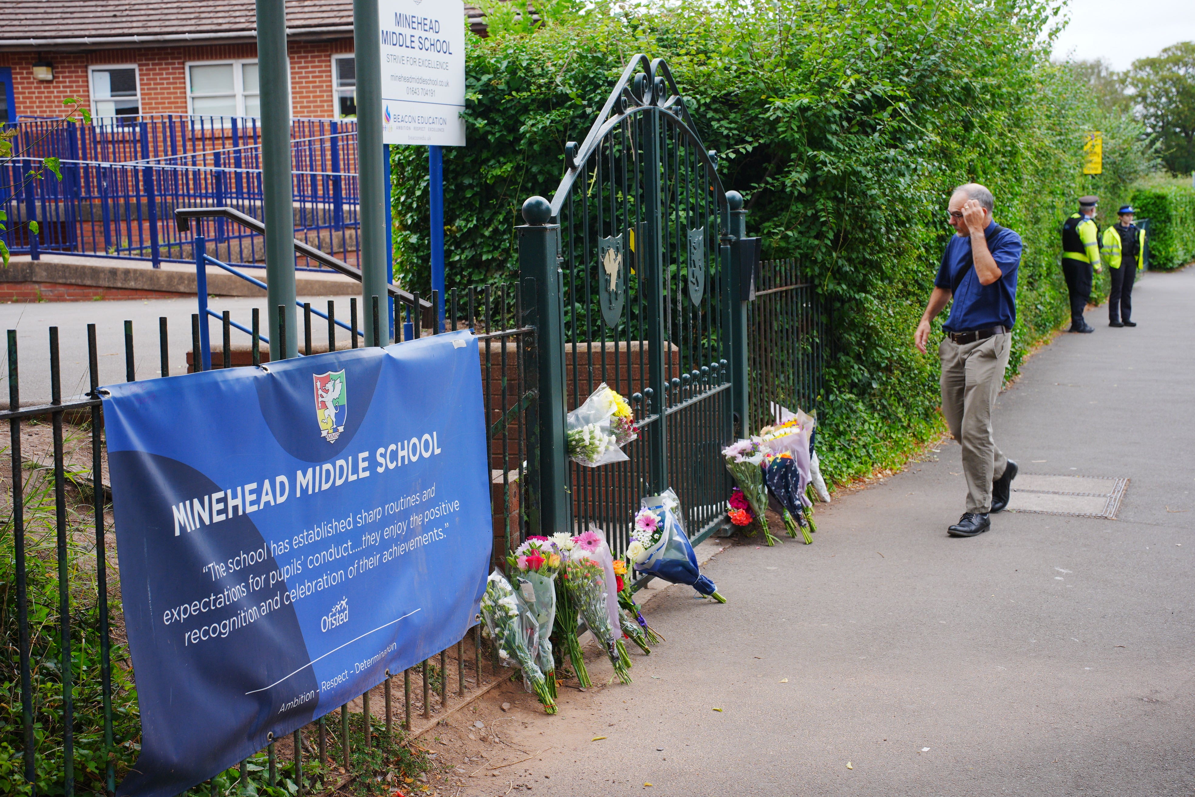 Tributes have been left outside Minehead Middle School in Somerset (Ben Birchall/PA)