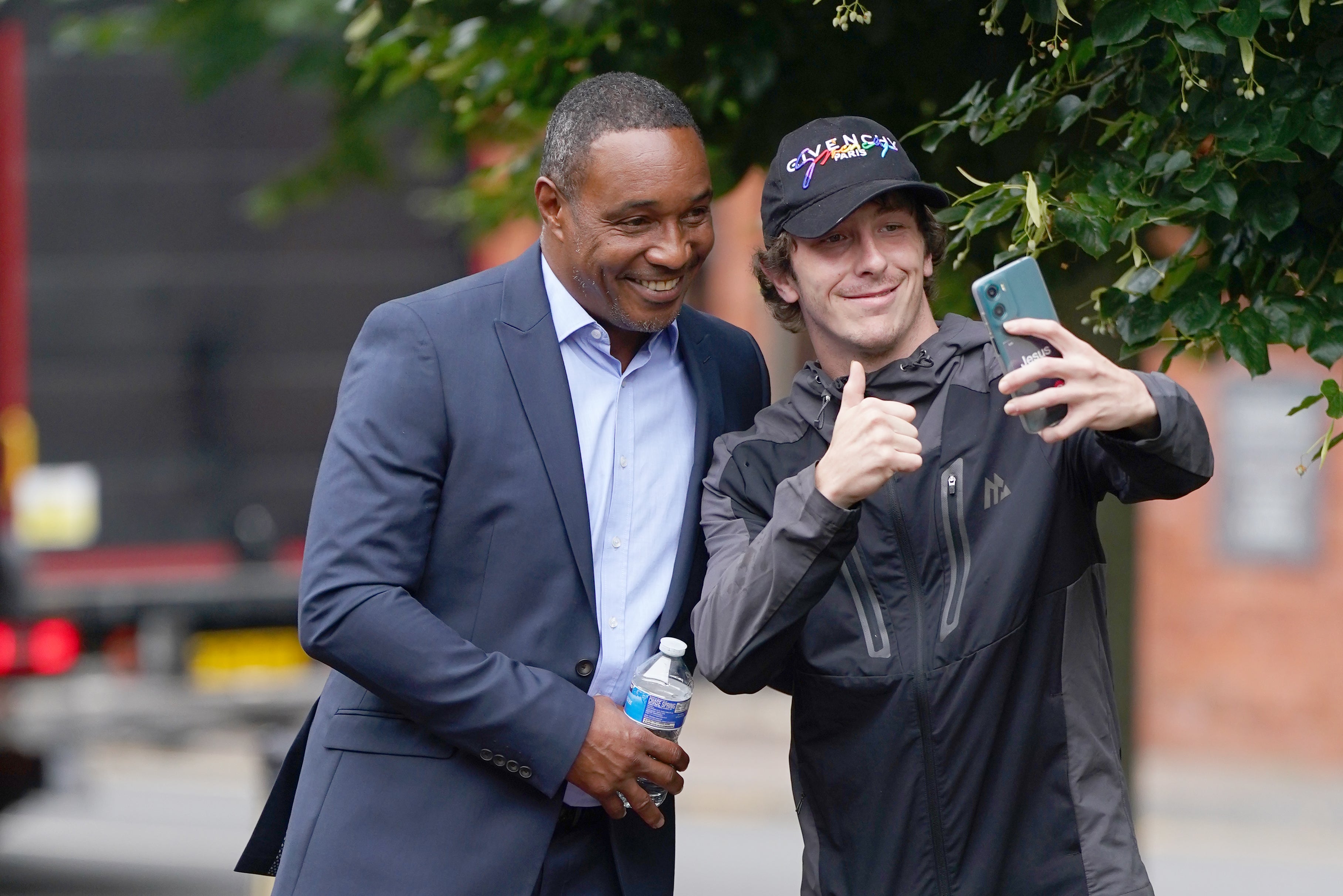 Paul Ince posing for a selfie with a fan outside court (Jacob King/PA)