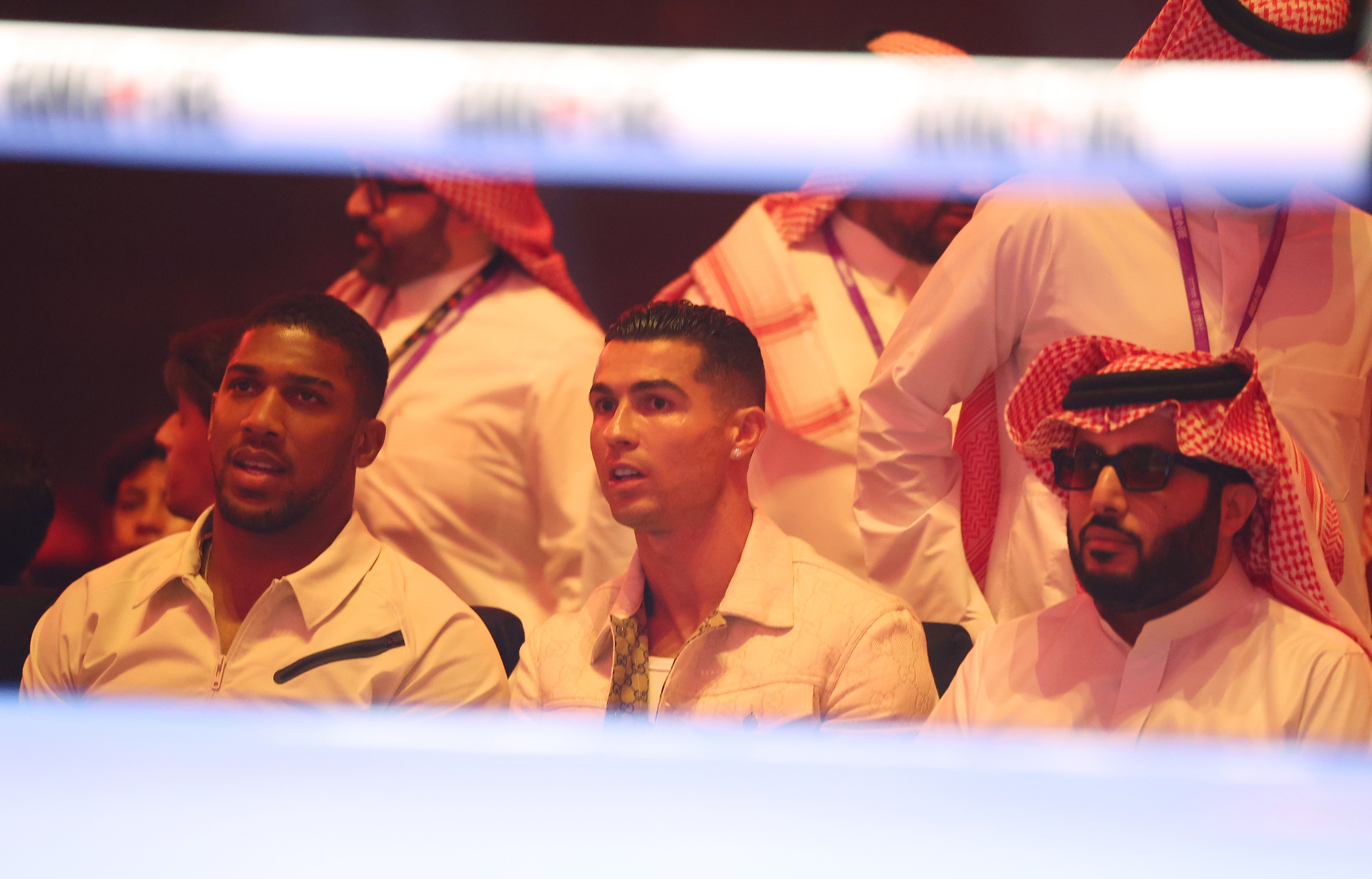 Anthony Joshua (left) with Turki Alalshikh (right) and Cristiano Ronaldo