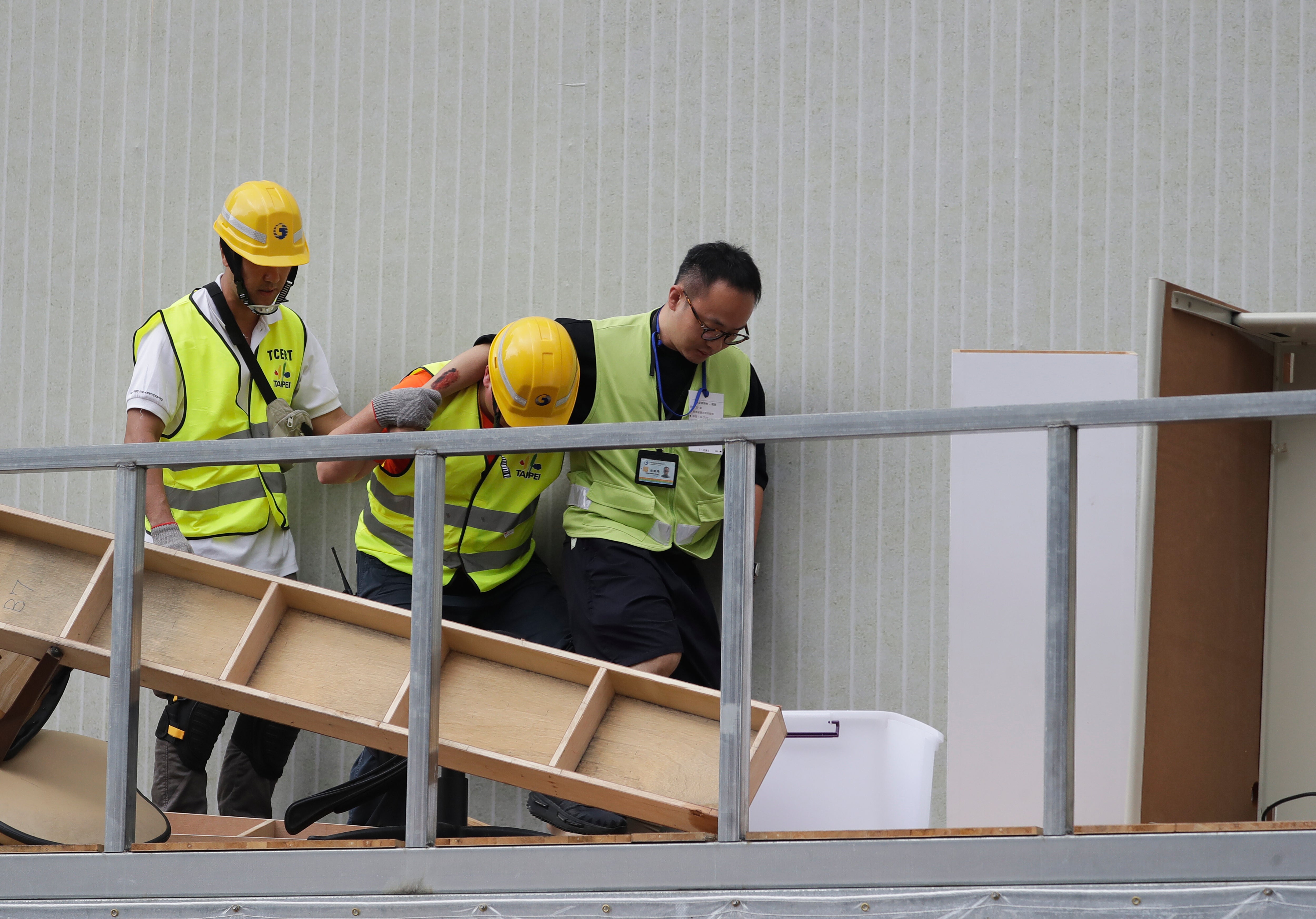 People take part in an air raid drill in Taipei