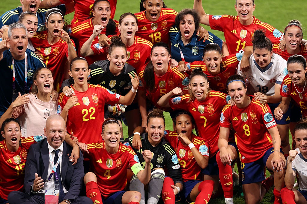 Players and staff of Spain celebrate their first Euros semi-final since 1997