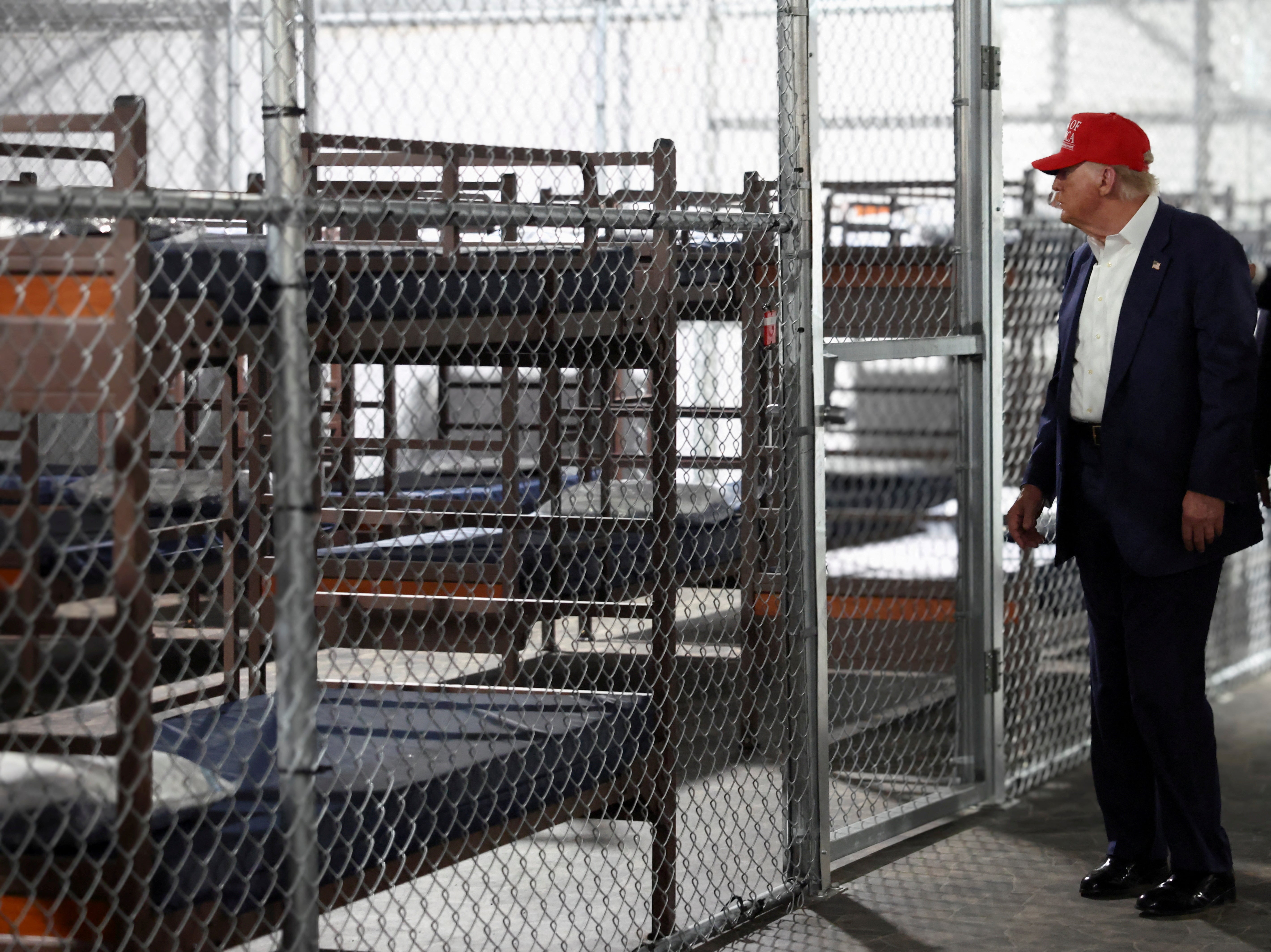 U.S. President Donald Trump visits a temporary migrant detention center informally known as "Alligator Alcatraz”