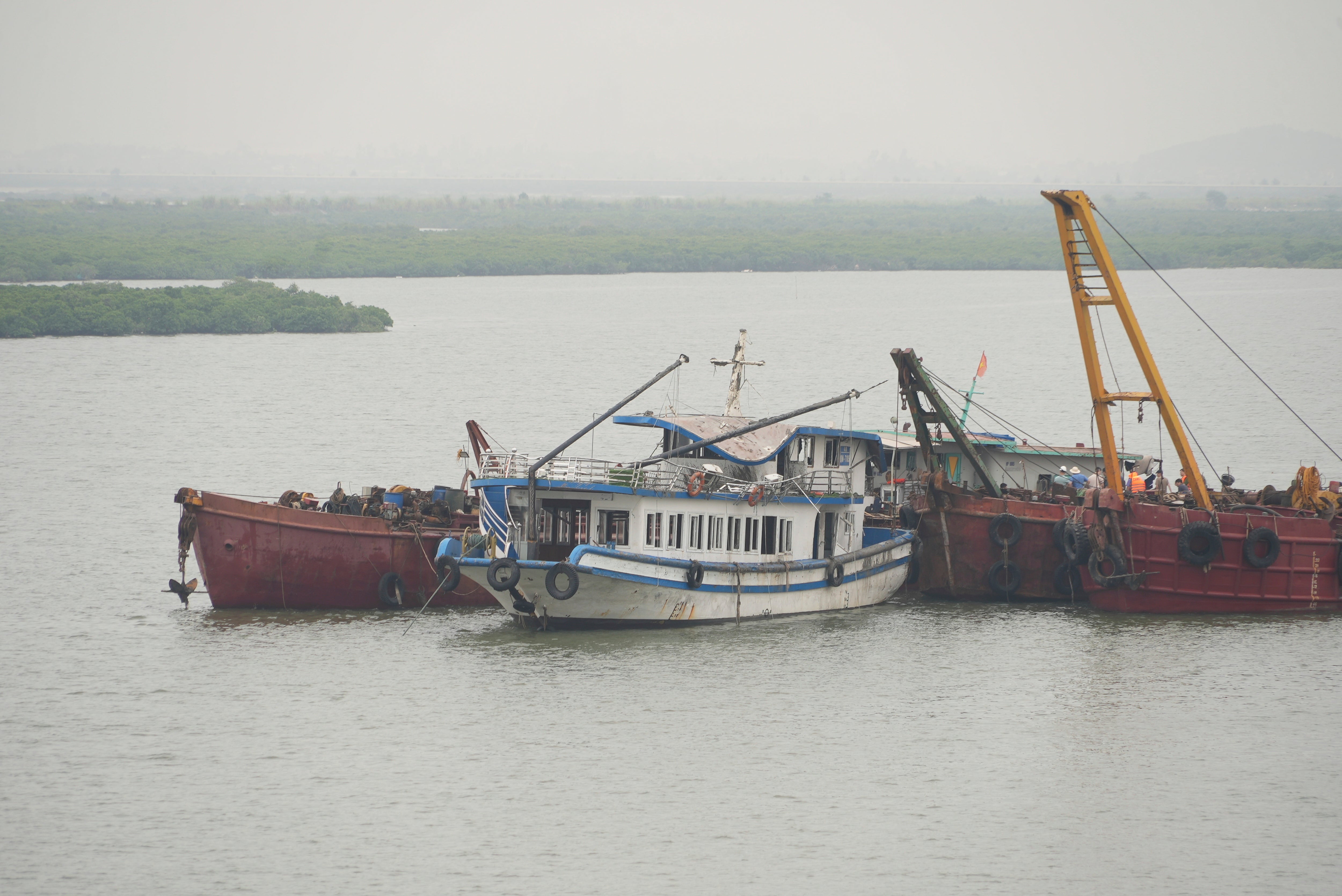 Tourist boat Wonder Sea is towed to a shipyard for investigation after its capsizing, which killed multiple people, in a thunderstorm in Ha Long Bay, Vietnam