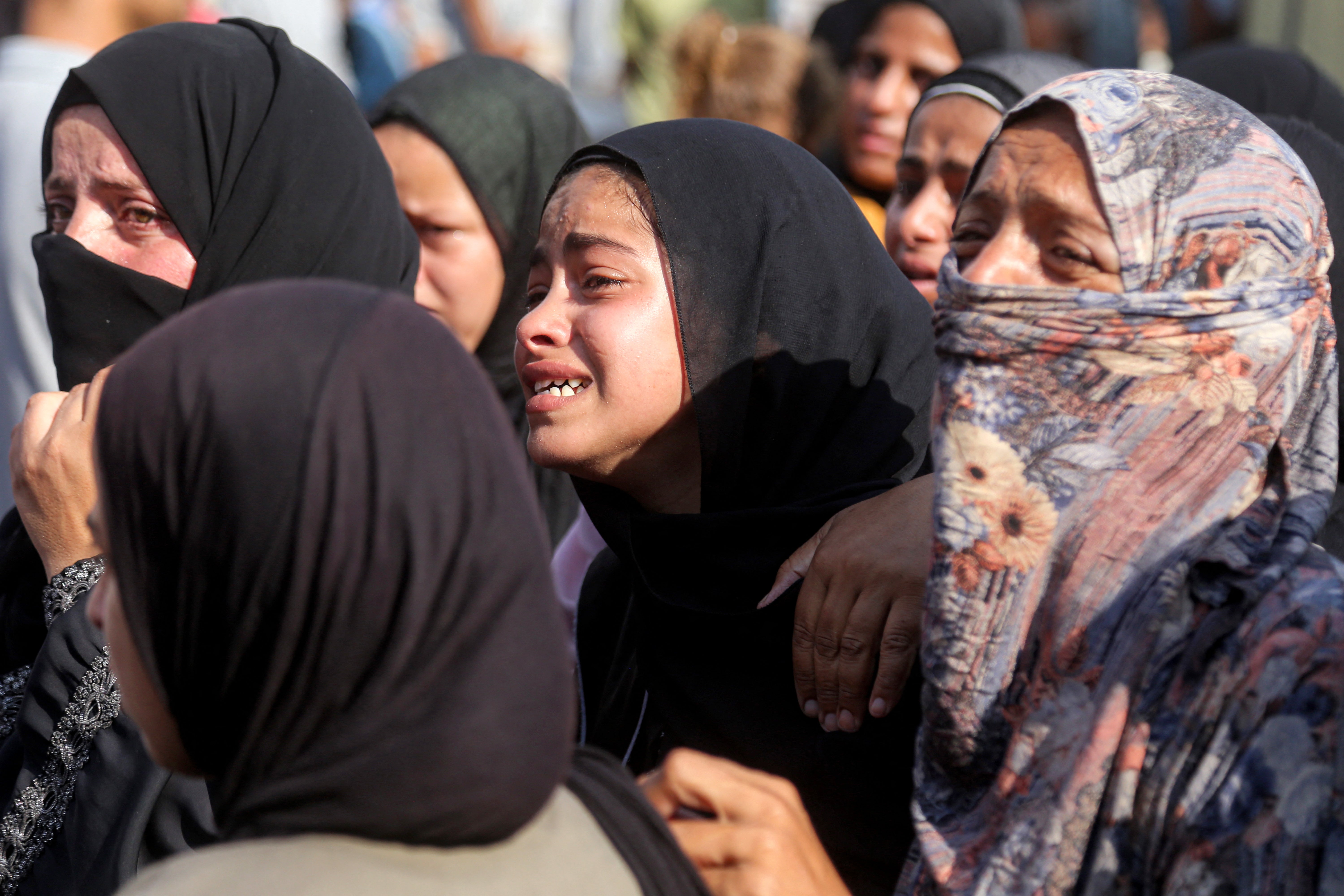 Women mourn during the funeral of victims killed the previous day by Israeli bombardment at Nasser Medical Complex in southern Gaza