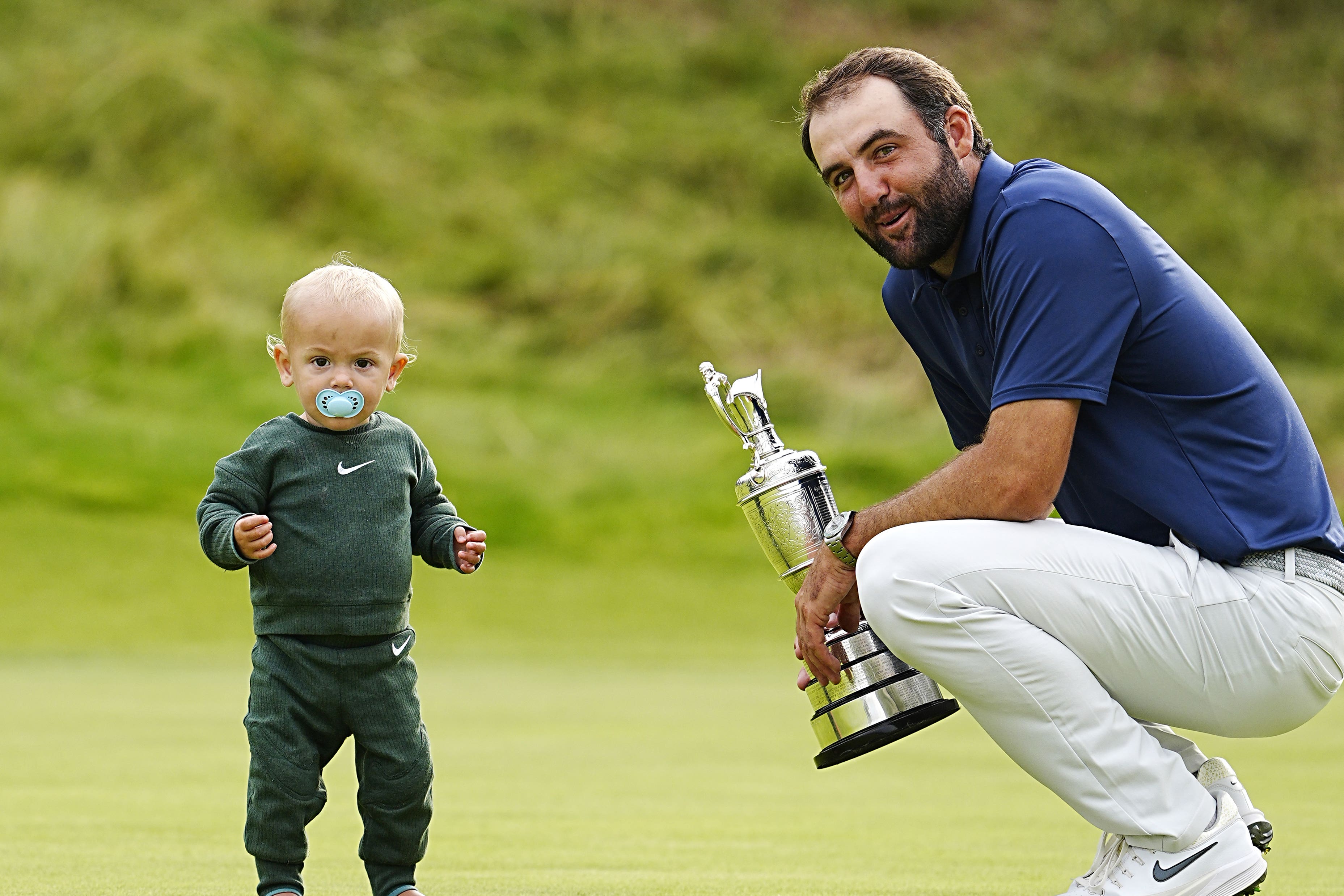 Scottie Scheffler with son Bennett and the Claret Jug (Peter Byrne/PA)