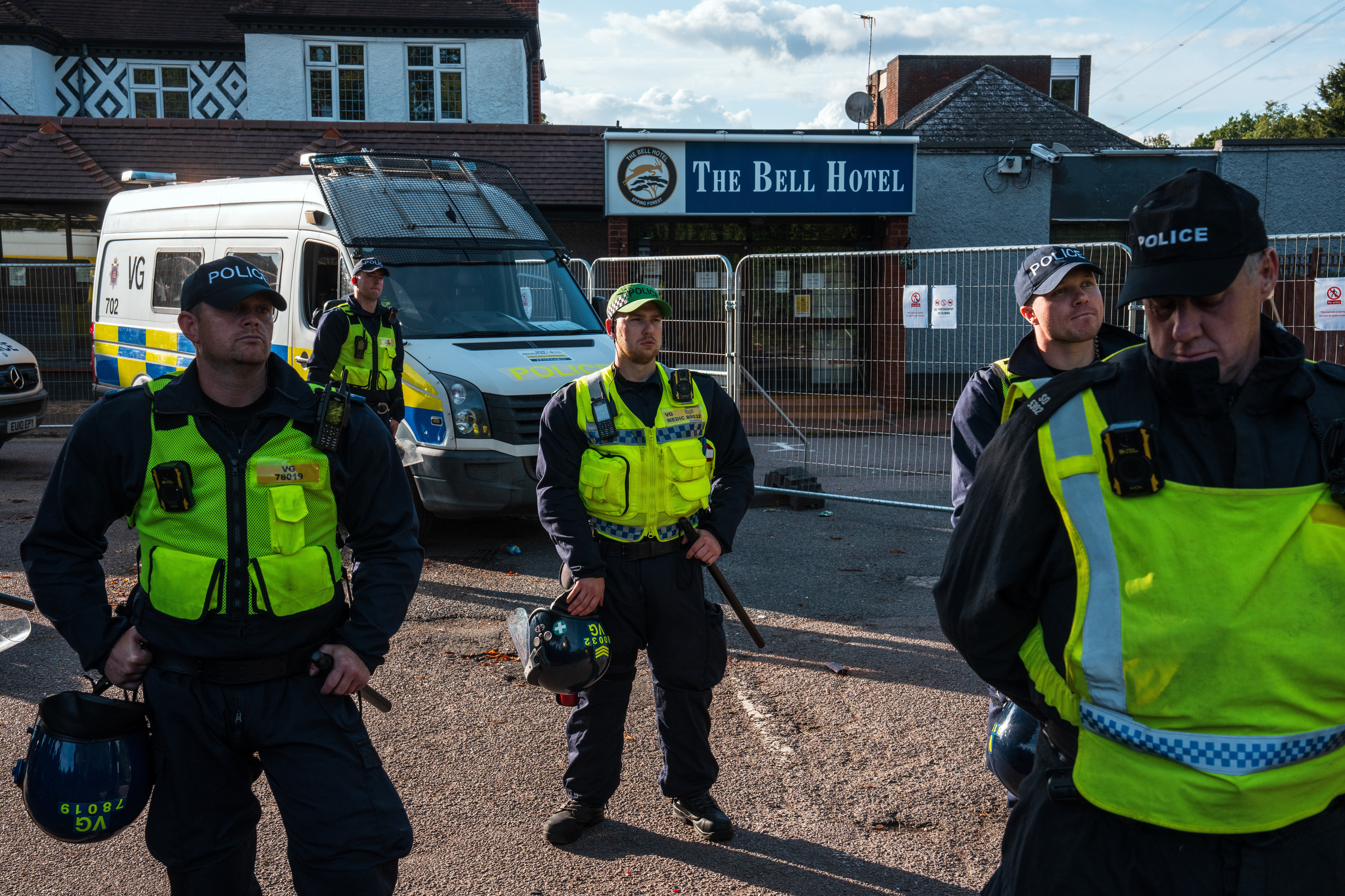 Police protect the Bell Hotel in Epping on 20 July
