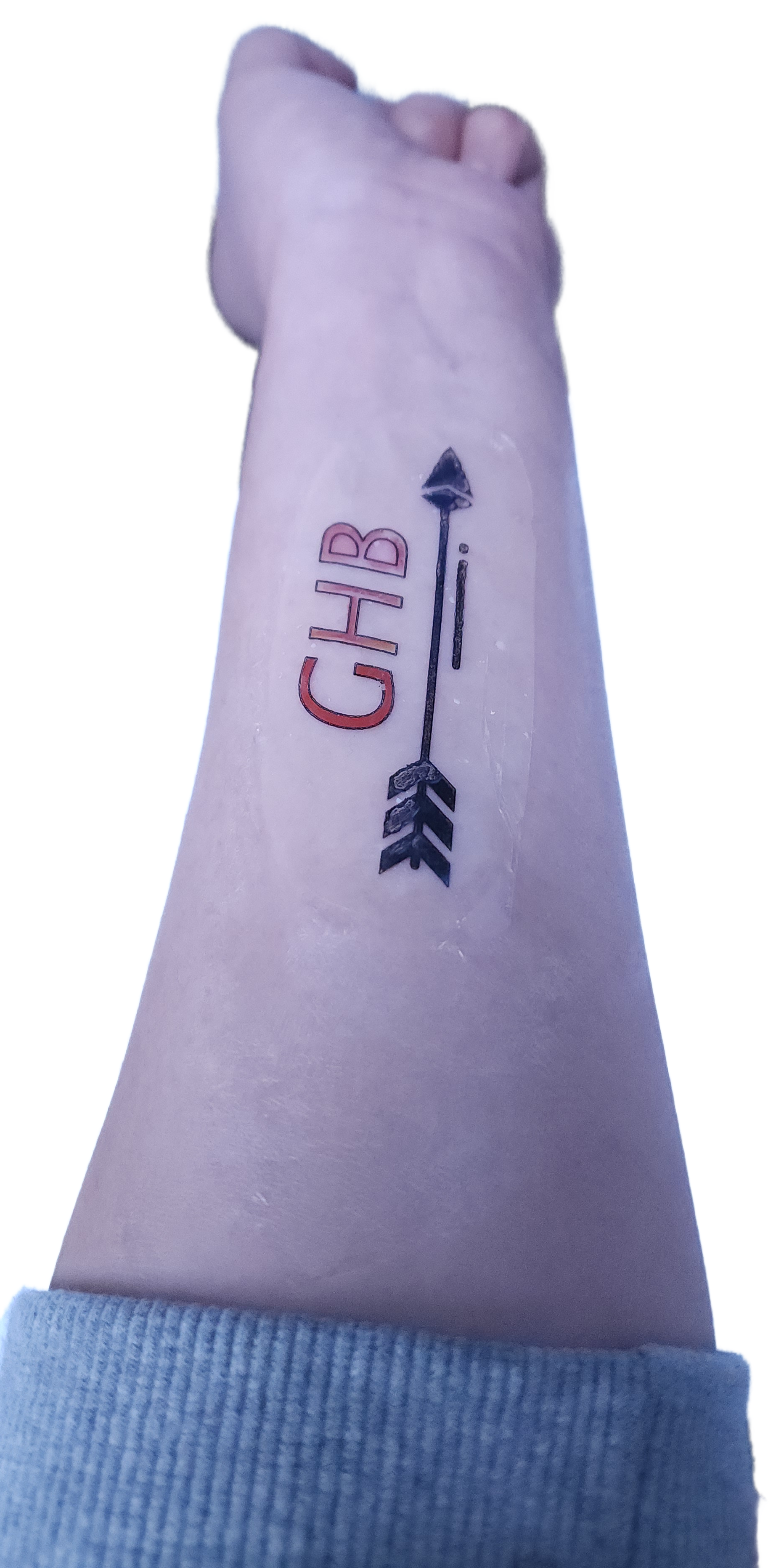 This tattoo-like sticker, which can be printed in a variety of designs, detects the presence of a drug often used to “spike” drinks — the letters turn red when exposed to it