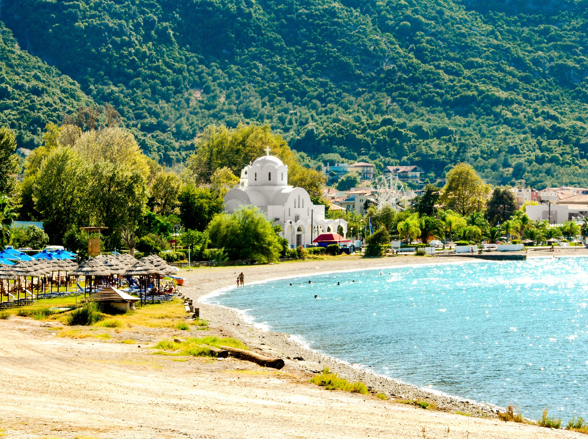 The bay of Kamena Vourla with its pretty white church