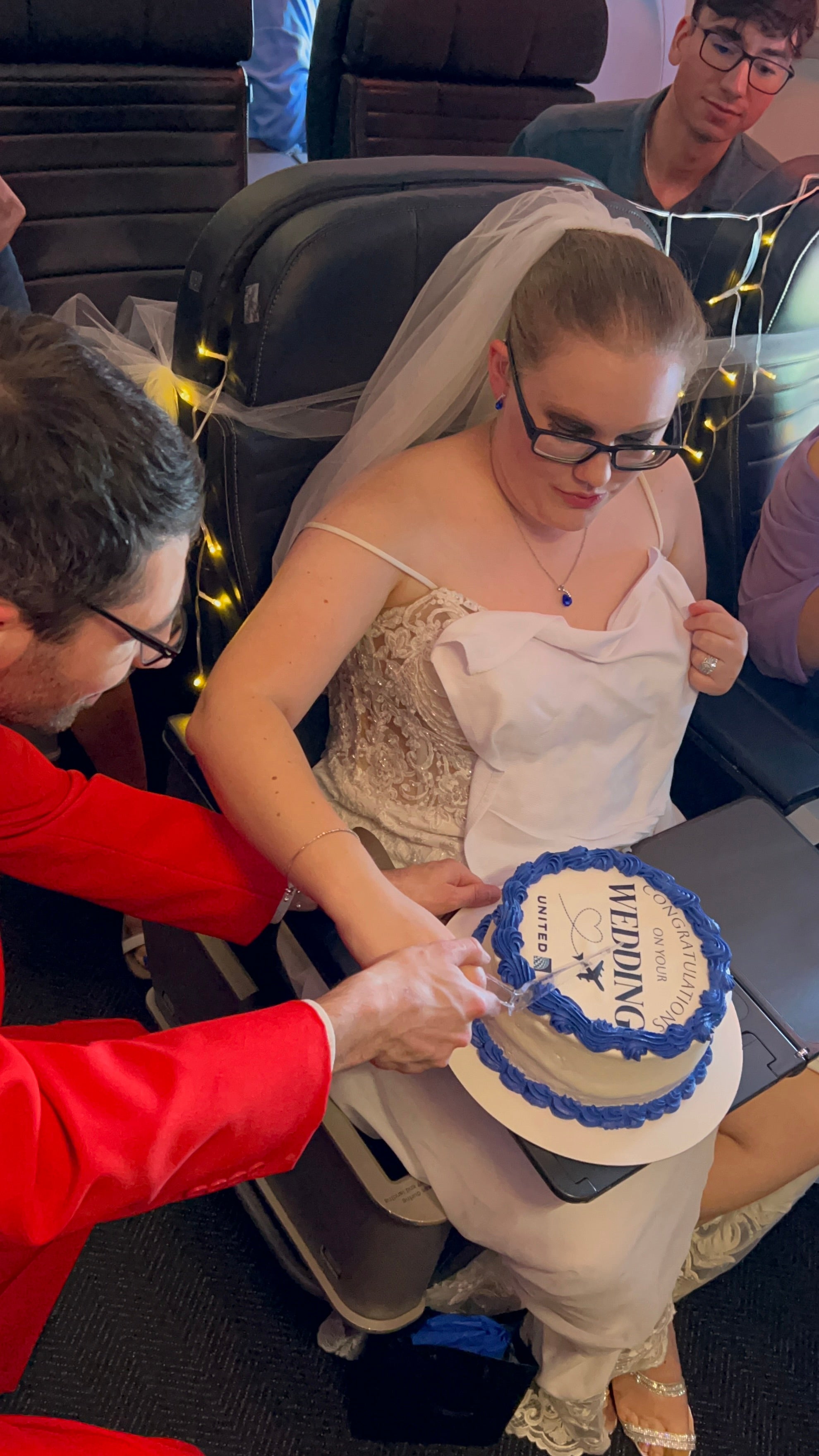 Jake and Abi cut their cake in the cabin