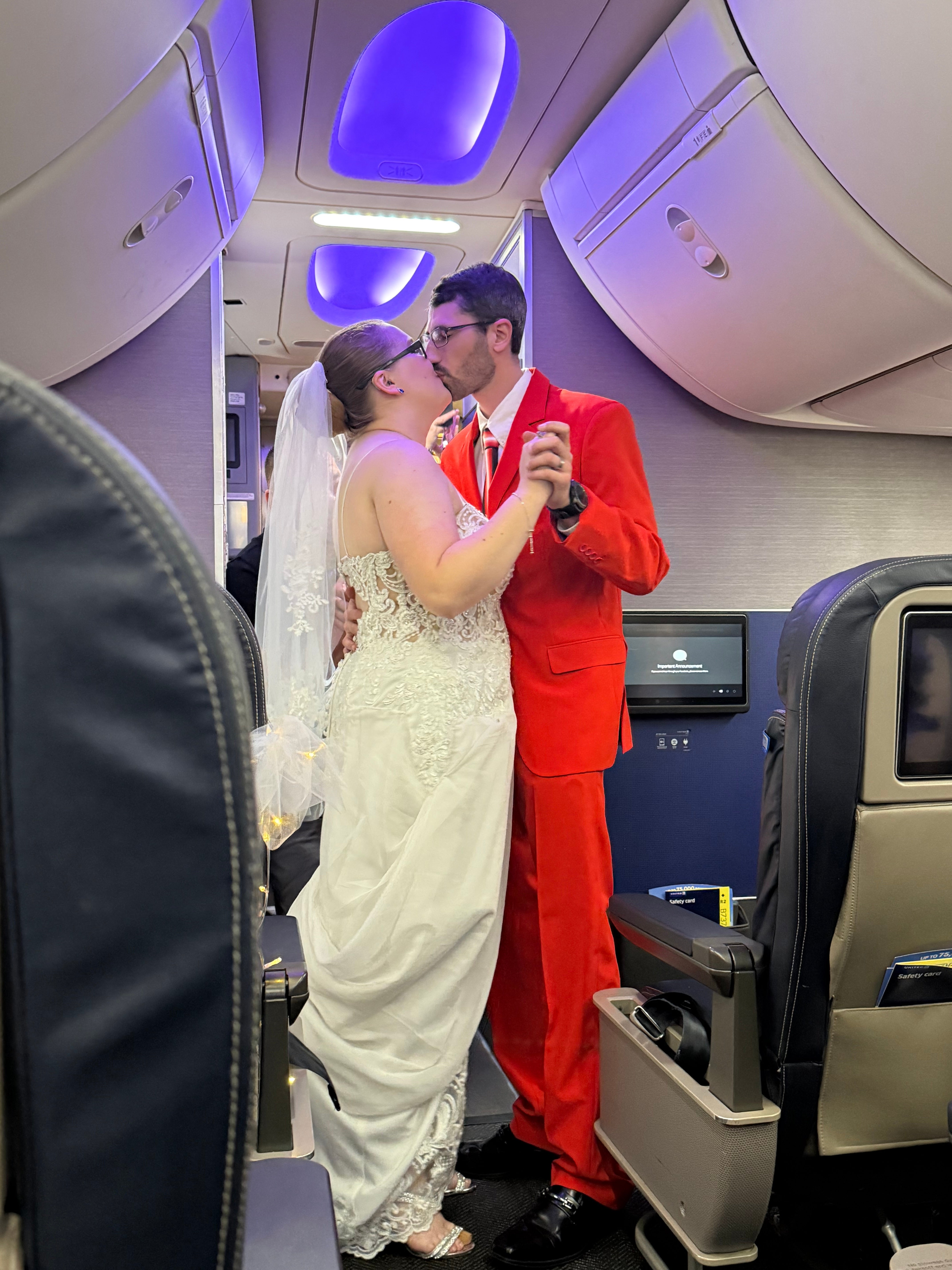 The happy couple share a kiss