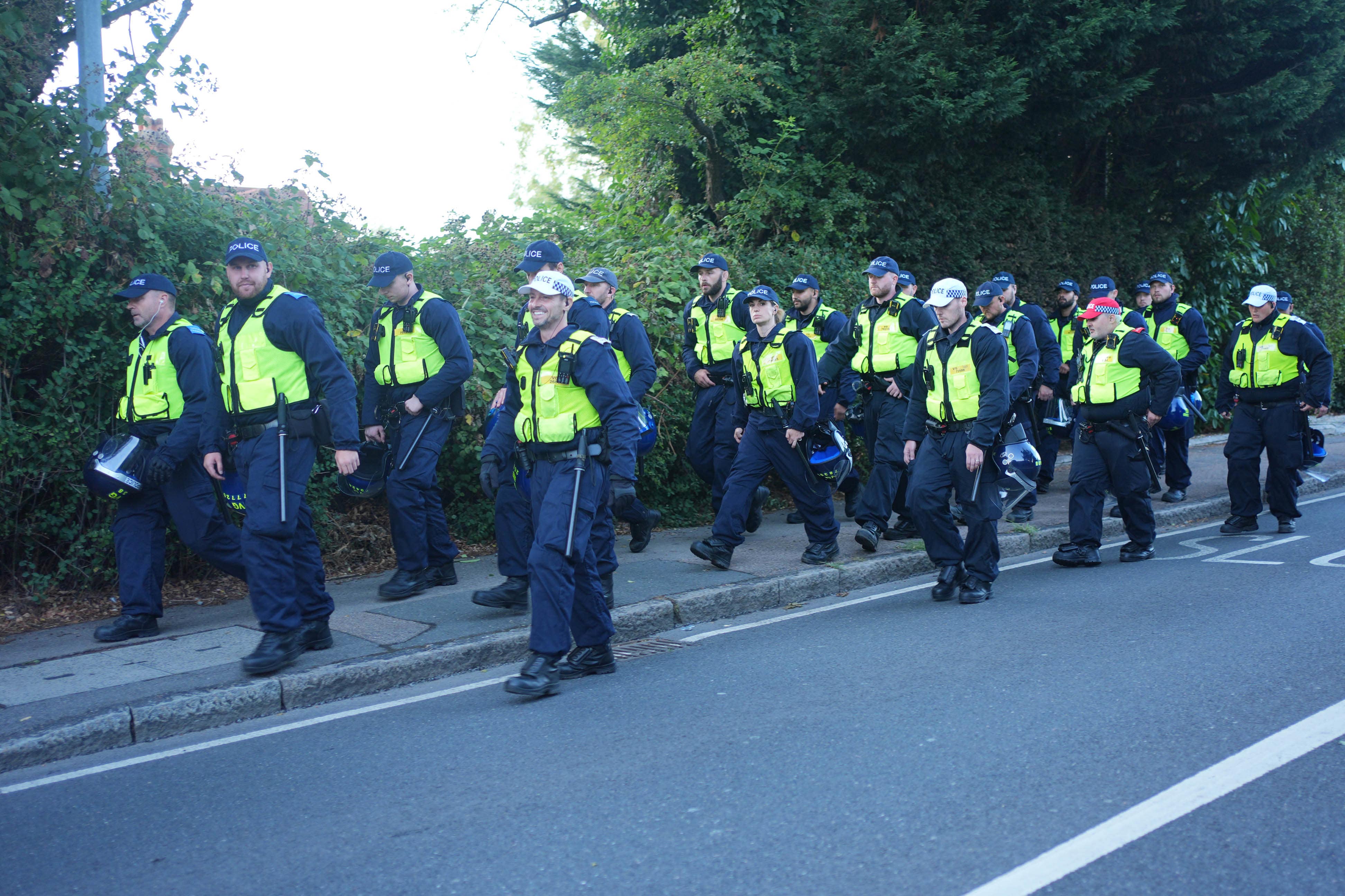 Police near the Bell Hotel in Epping, Essex, during a protest