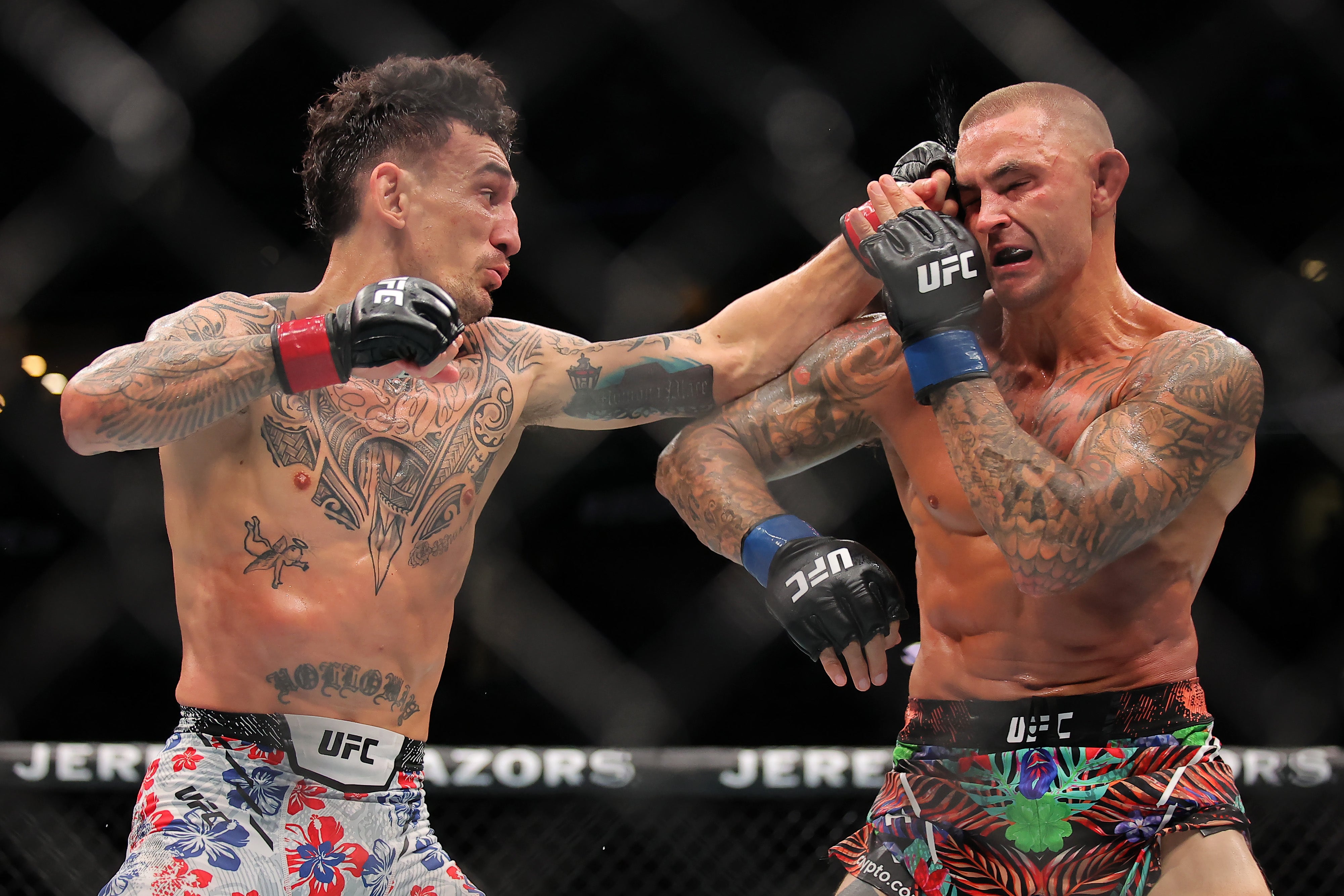 Dustin Poirier (right) during his retirement fight, a loss to Max Holloway in July