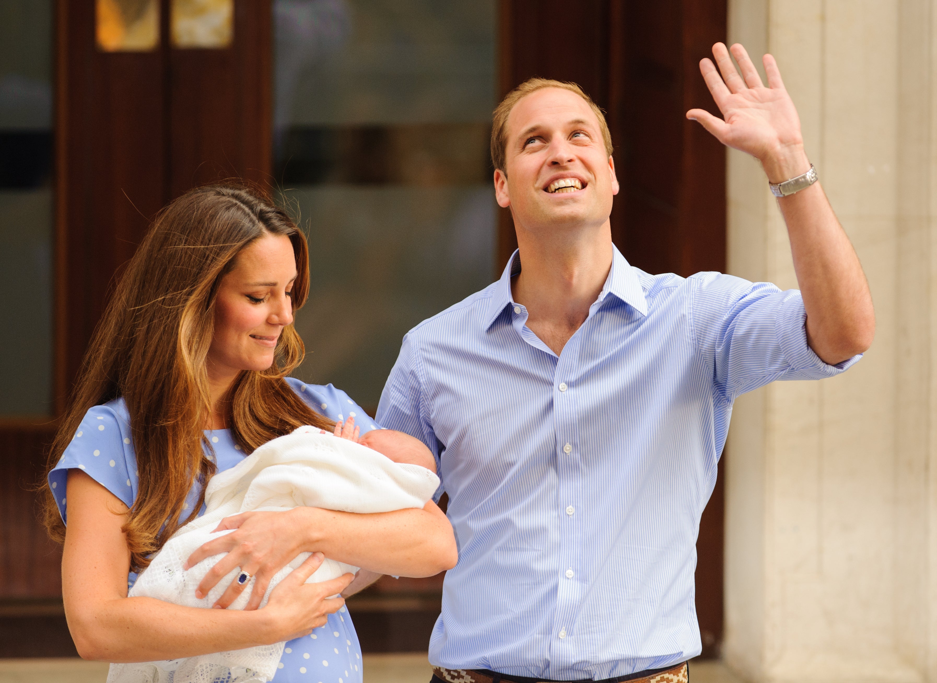 William and Kate leave the Lindo Wing of St Mary’s Hospital in London with their newborn son, Prince George, in 2013