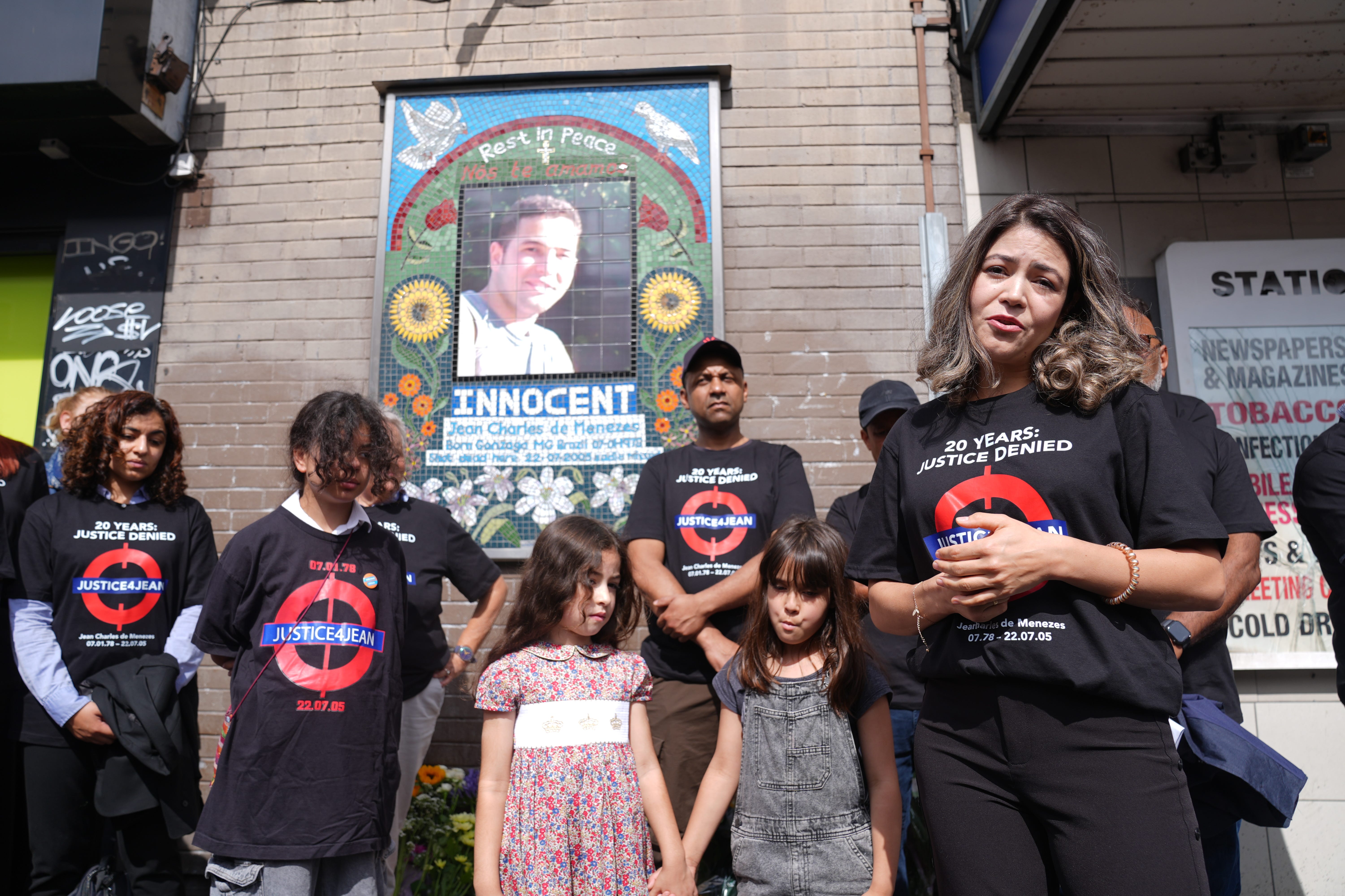 Vivian Figueiredo (right), the cousin of Jean Charles de Menezes, speaks during a vigil outside Stockwell station in London, to mark the moment when the Brazilian was shot dead by the Metropolitan Police 20 years ago (Lucy North/PA)