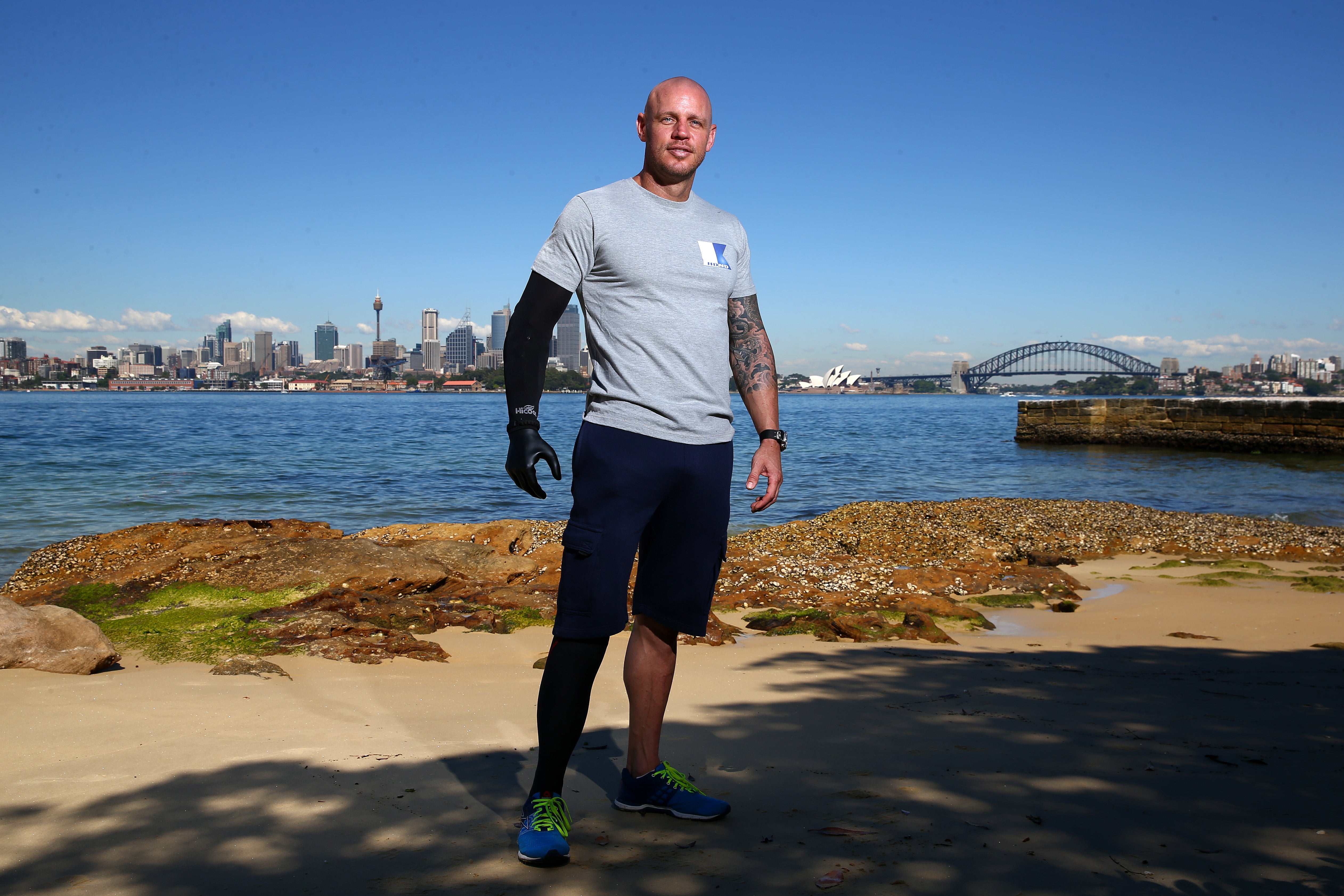 Paul De Gelder poses in front of the Sydney Harbor, where he was attacked. De Gelder said the shark had latched on to his right hand and leg in one bite, pulling him underwater