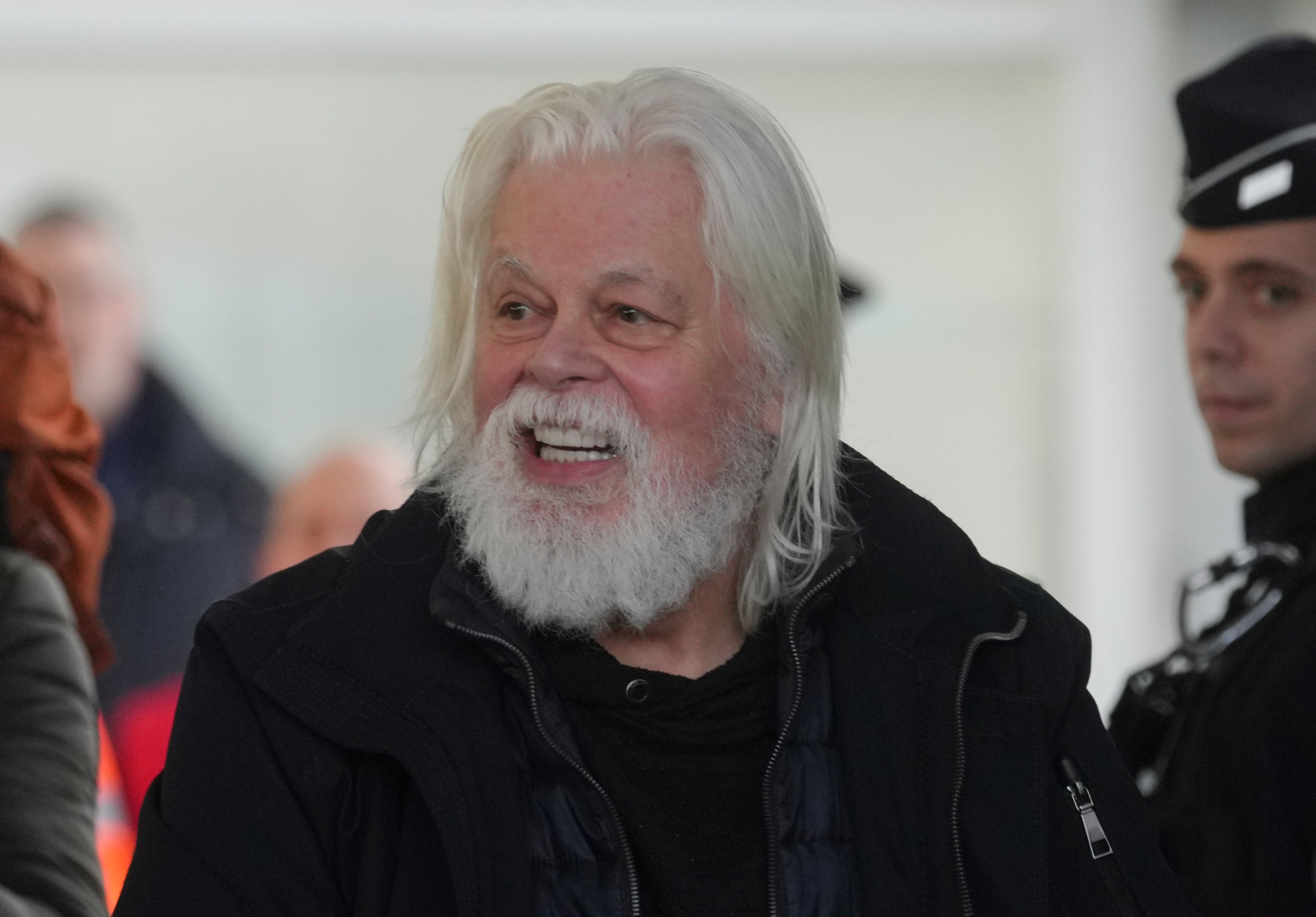 Environmental activist Paul Watson smiles as he arrives at Charles de Gaulle's airport in Roissy, north of Paris, Dec. 20, 2025 after being released from prison few days ago