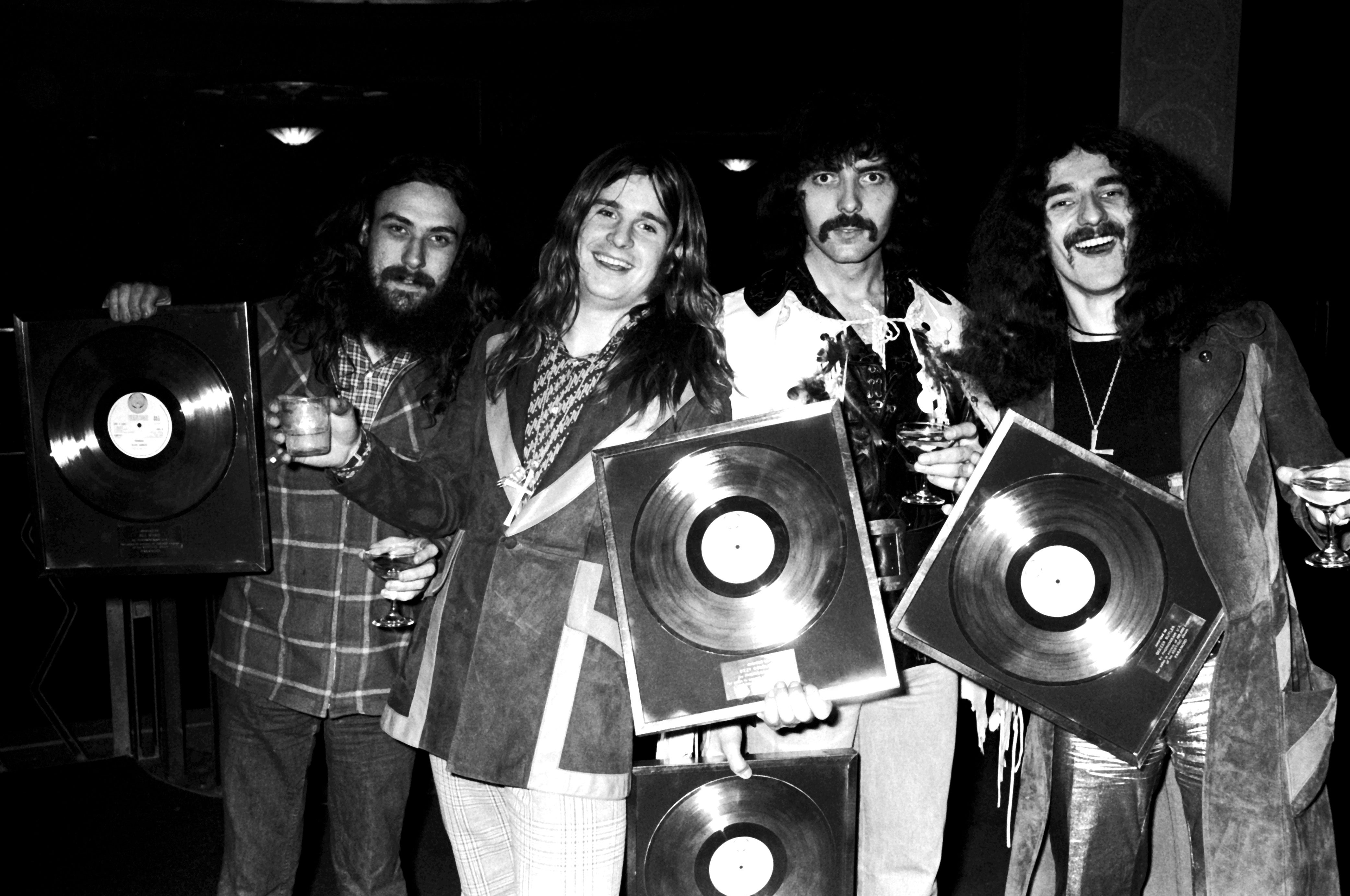 Ozzy Osbourne and Black Sabbath pose for a group portrait with gold discs in London, 1973