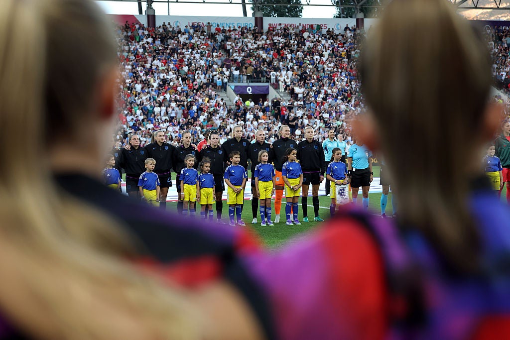 England's substitutes stood arm-in-arm ahead of kick-off