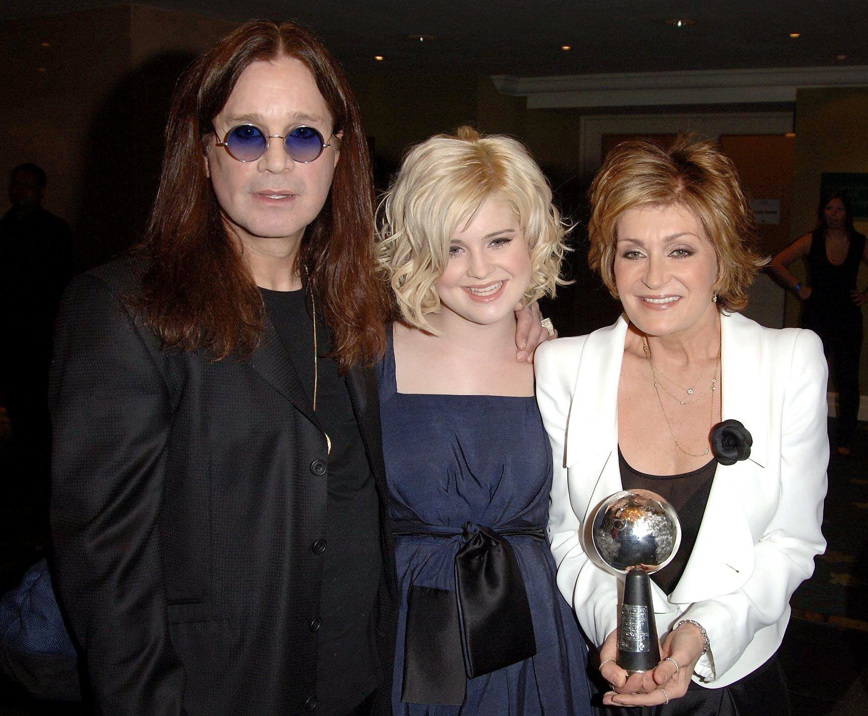 (l to r) Ozzy, Kelly and Sharon Osbourne collect the 2006 Silver Clef Award at the Nordoff Robbins Silver Clef Awards, at the Hilton Hotel, central London (Ian West/PA)