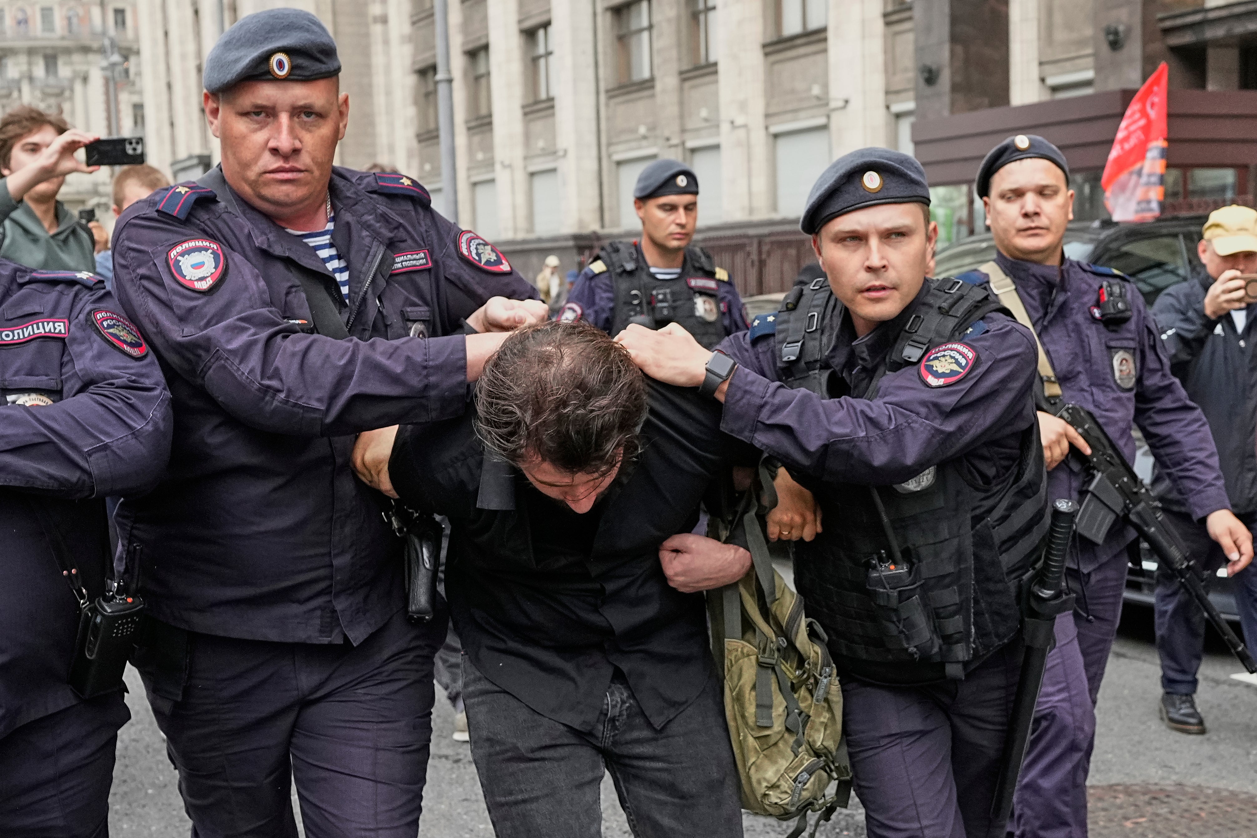 Police detain an activist in front of the State Duma, the lower house of the Russian parliament before lawmakers approved a bill that punishes online searches for information that is deemed ‘extremist’