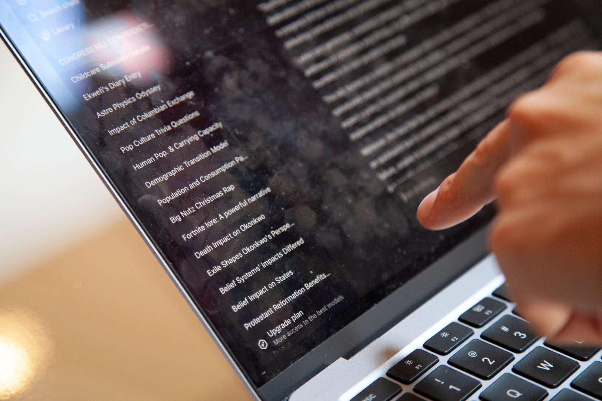 Bruce Perry, 17, shows his ChatGPT history at a coffee shop
