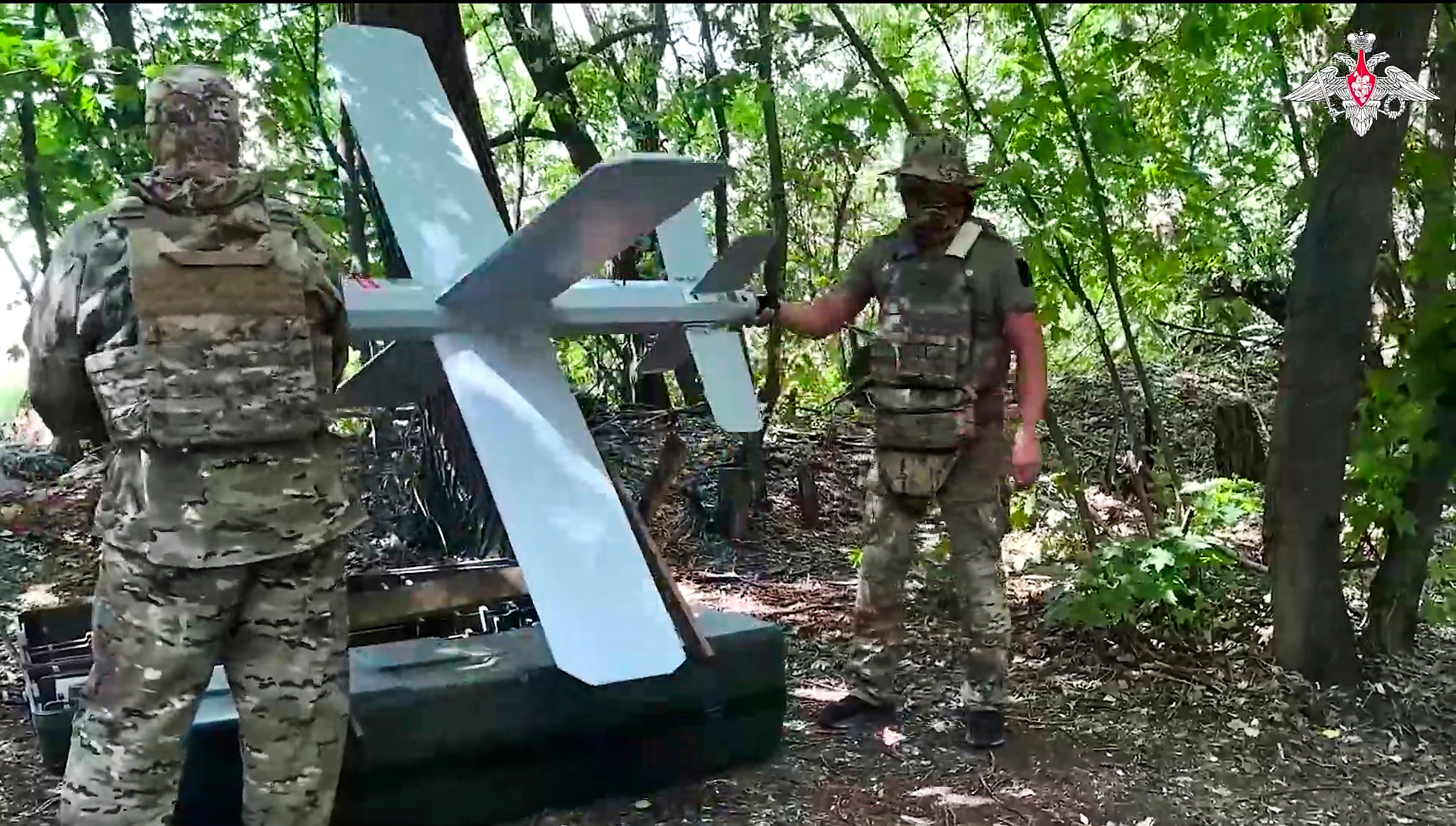Russian soldiers prepare a Lancet drone for action in an undisclosed location in Ukraine on 23 July
