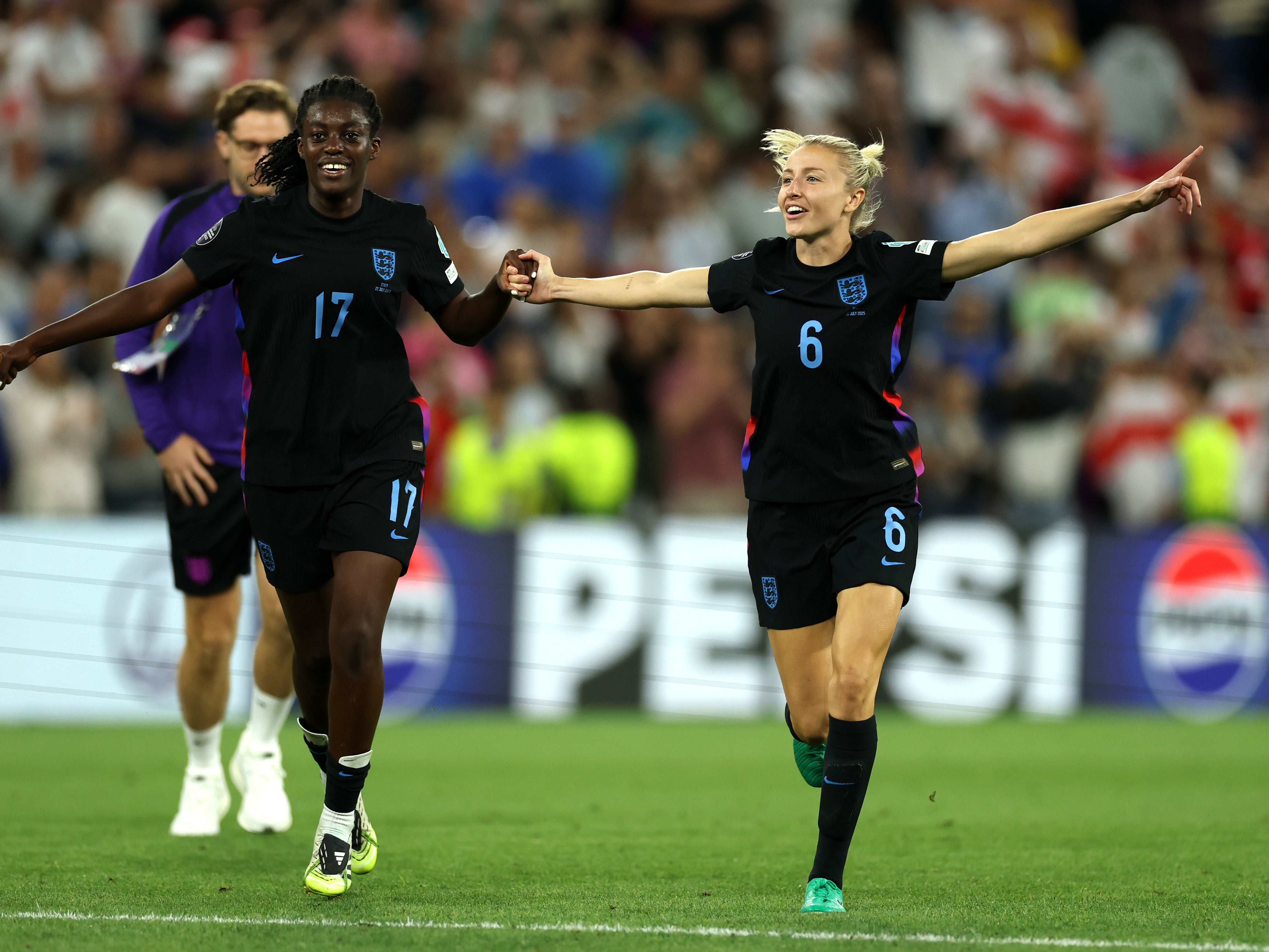 Michelle Agyemang and Leah Williamson celebrate their victory in Geneva