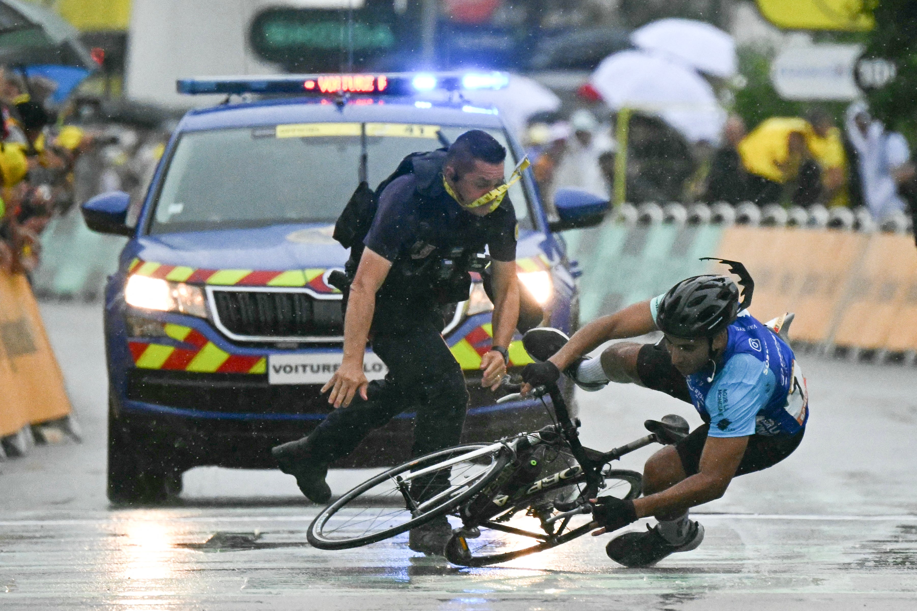 A spectator was tackled by security attempting to cycle over the finish line