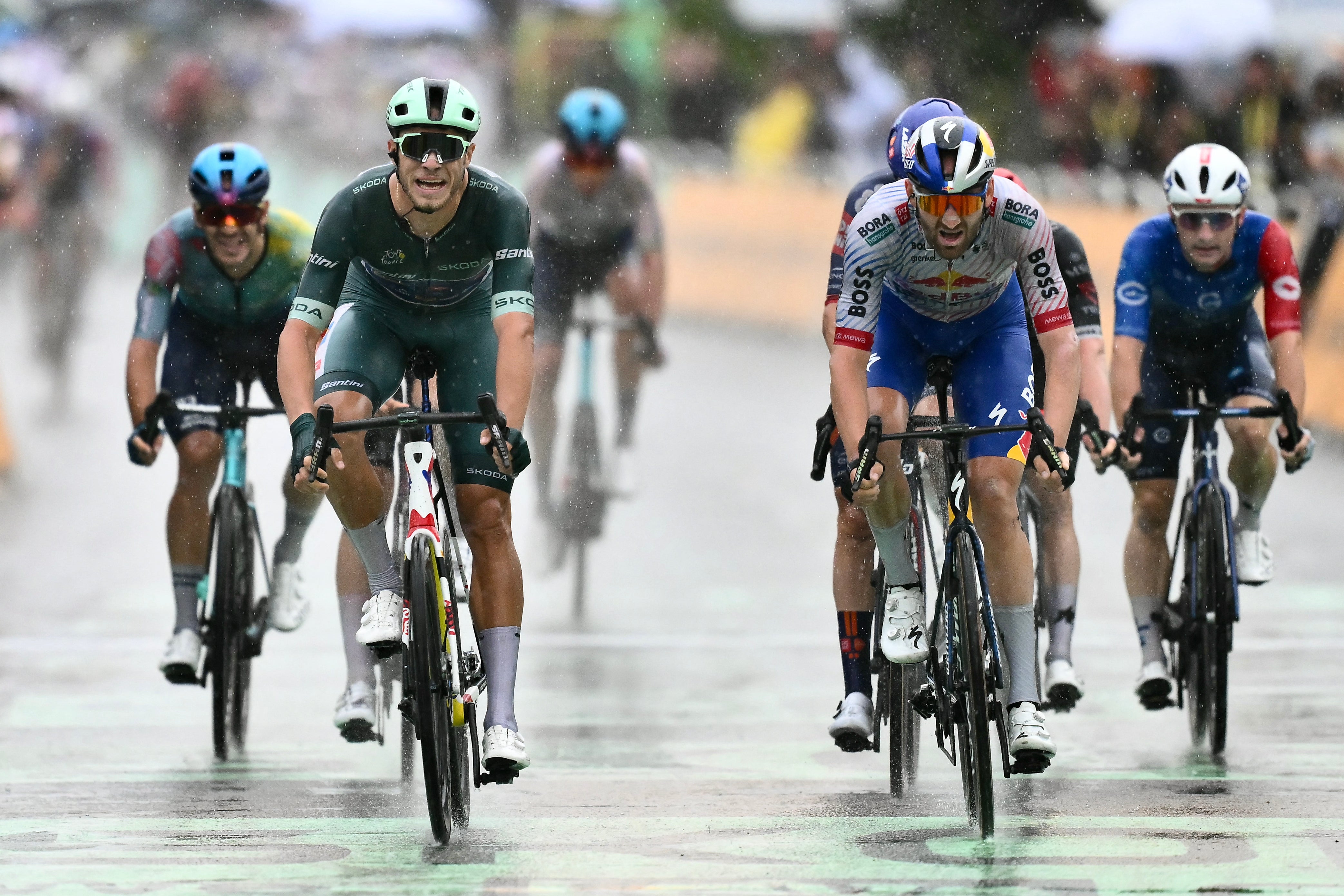 Milan won a reduced sprint with many of his rivals held up by the crash
