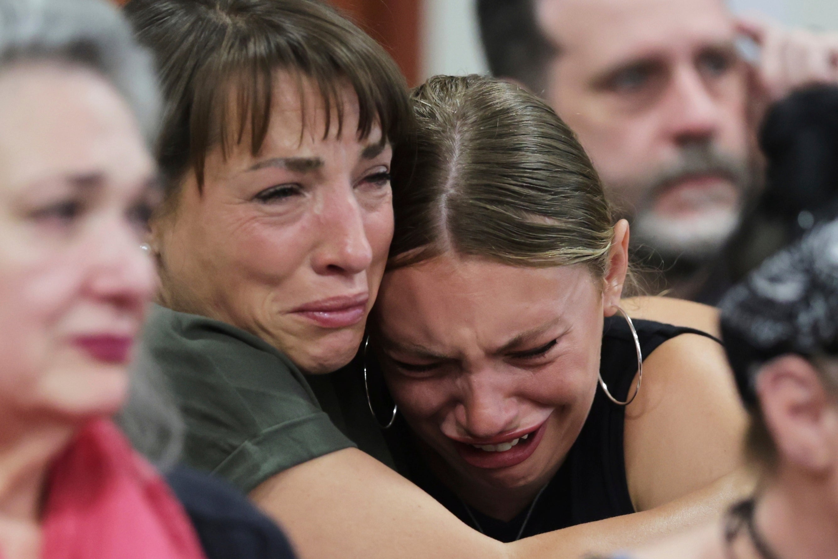 Dylan Mortensen gets a hug after speaking at the sentencing hearing of Bryan Kohberger at the Ada County Courthouse, for his sentencing hearing, Wednesday, July 23, 2025, in Boise, Idaho