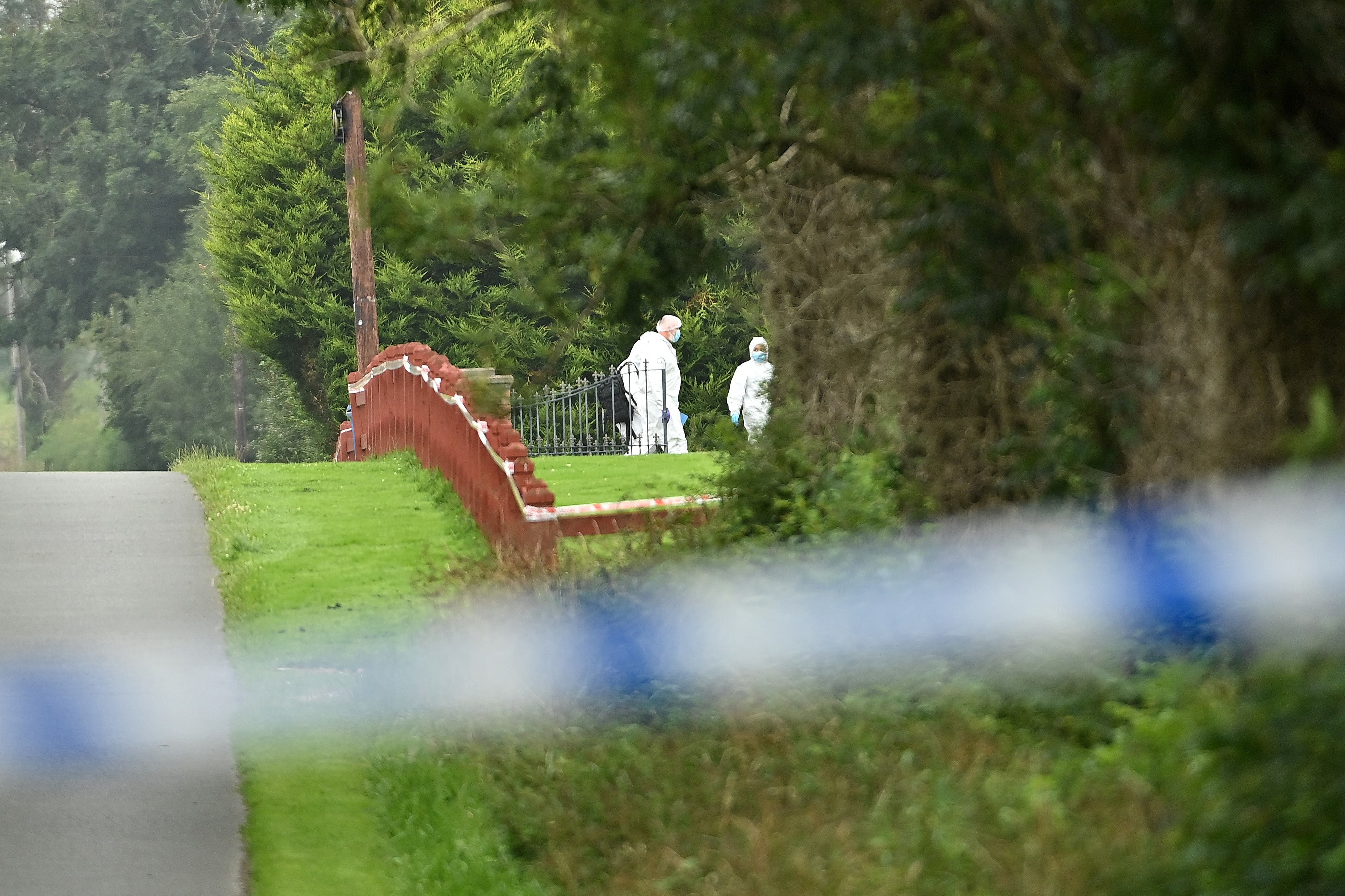 Forensic officers at the scene following the shooting