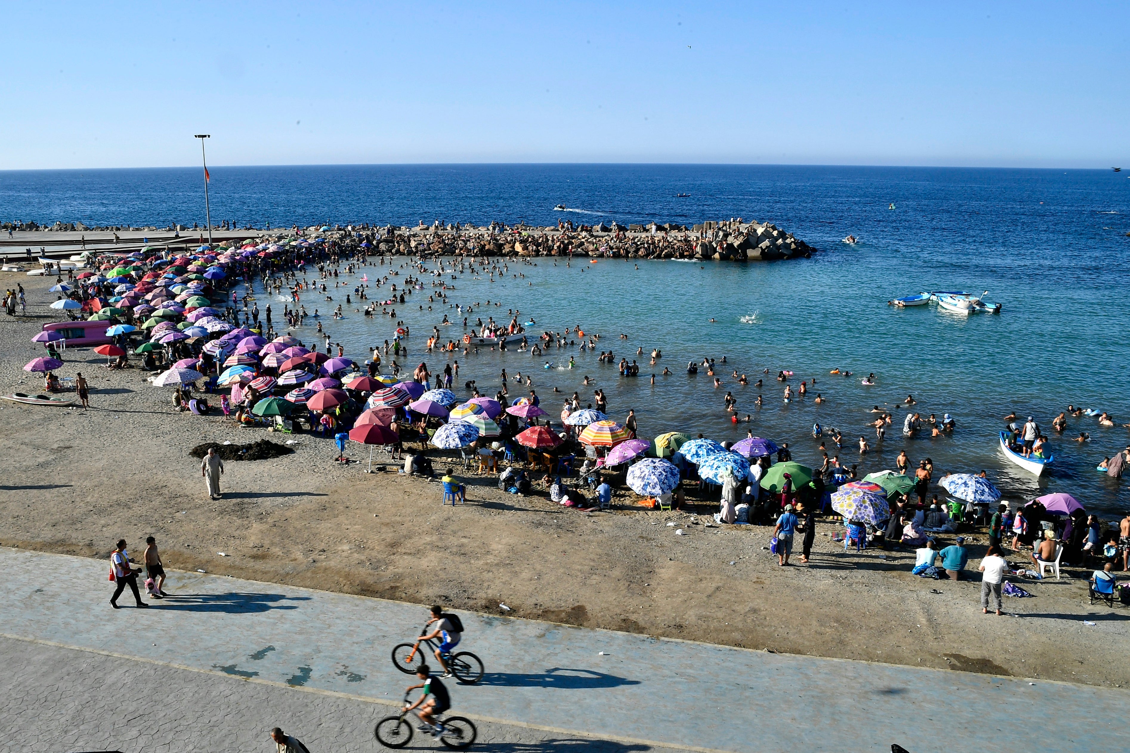 People enjoy the beach in Algiers