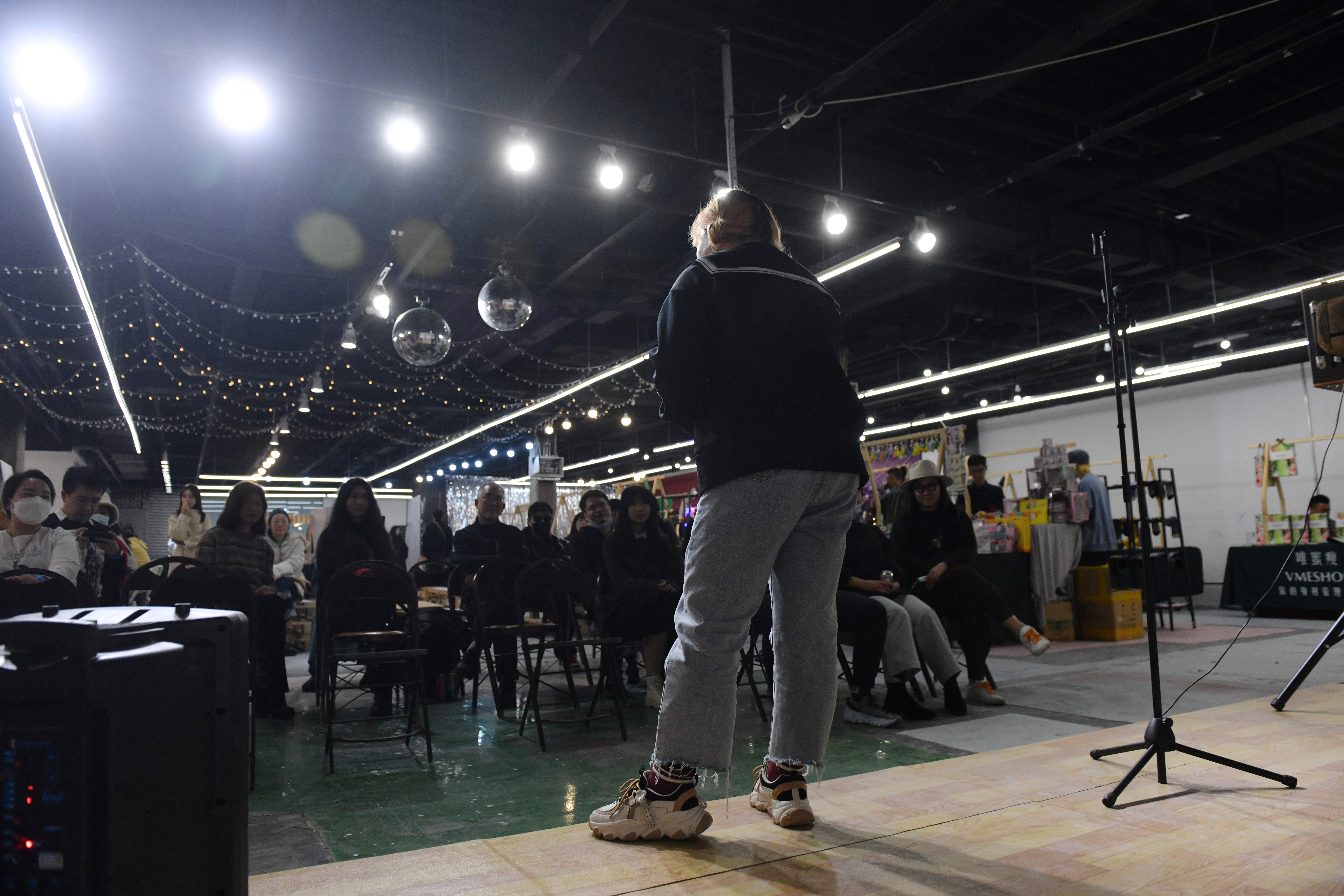 File. Comedian Qiqi performs at a mall in Beijing