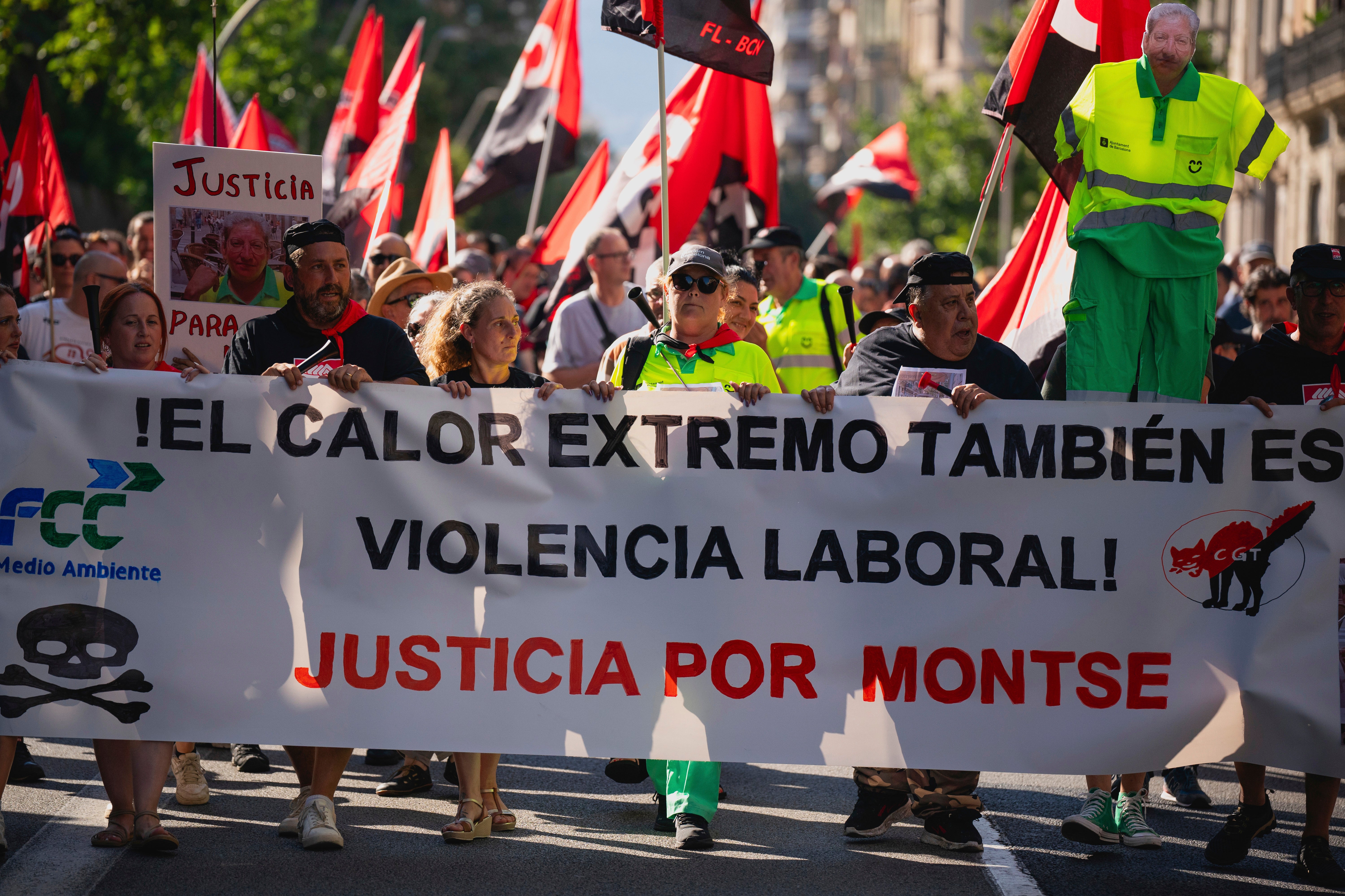 People march in Barcelona to protest the death of street cleaner Montse Aguilar during a recent heat wave in Spain, Wednesday, July 16, 2025. The banner in Spanish reads, “Extreme Heat is also Workplace Violence. Justice for Montse." (AP Photo/Joan Mateu Parra, File)